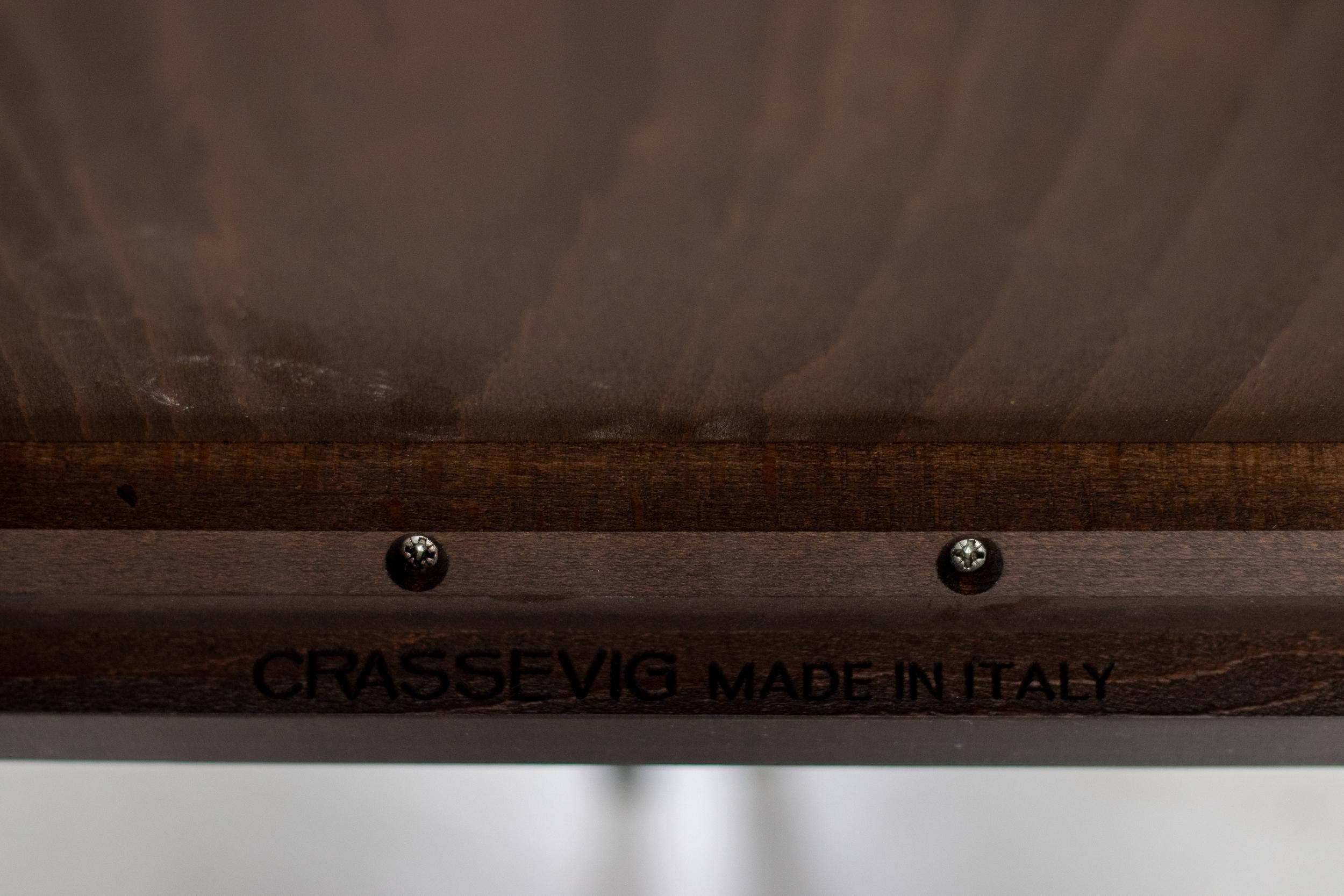 Very elegant Anna R dining chairs designed by Ludovica and Roberto Palomba for Crassevig, Italy. 
These chairs feature a dark brown solid wood frame with double-paneled back and a seat panel upholstered in black leather. Marked 'Crassevig made in