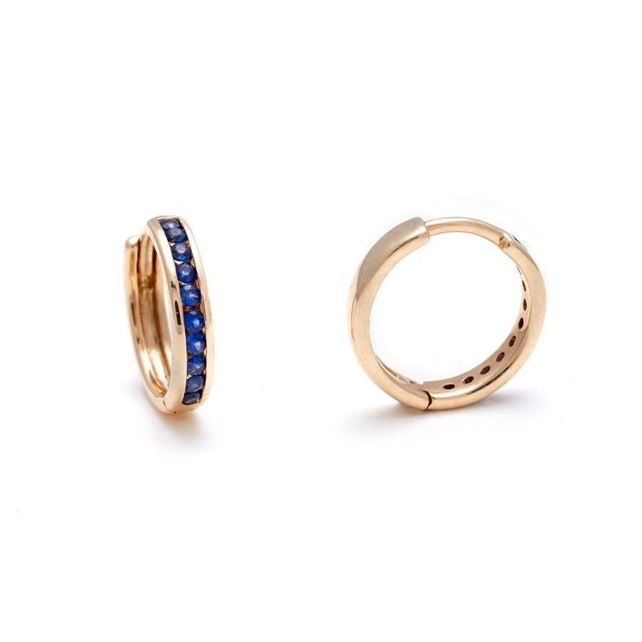Blue sapphires set in recycled 14k yellow, rose, or white gold. Sold as singles or pairs.

Hoop diameter: 9mm

Each sapphire is unique and may vary in appearance and price from what is depicted on the site.

The Licol Hoops are equal parts delicate