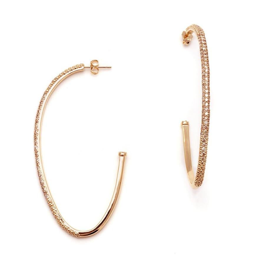 Champagne diamonds set in 14k rose gold. Sold as a pair.

This ultra luxe version of our signature Egg-shaped hoops feature champagne diamond encrusted rose gold. With inverted champagne diamond details at the back of each, the open hoops are made