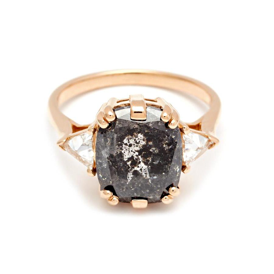 One-of-a-kind 5.55ct cushion natural black diamond with 0.36ctw white diamond trillions set in 14k recycled yellow gold.

This Bea Three Stone ring features a cushion cut black ‘painted’ diamond, so called for the beautiful inclusions that trace
