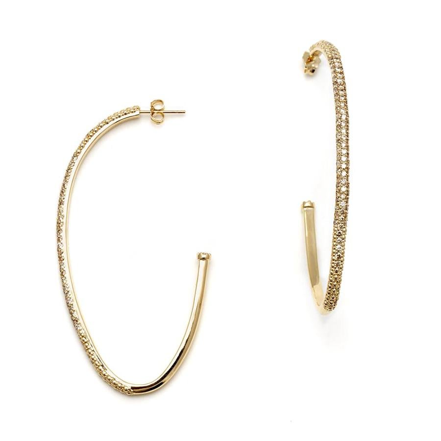 Champagne diamonds set in 14k yellow gold. Sold as a pair.

This ultra luxe version of our signature Egg-shaped hoops feature champagne diamond encrusted yellow gold. With inverted champagne diamond details at the back of each, the open hoops are
