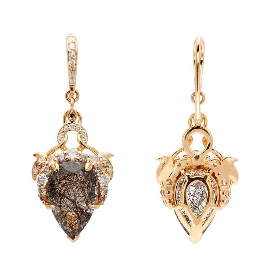 Black rutilated quartz with 0.83ctw black and grey diamonds and pavé earwires set in 18k yellow gold.

La Belle Époque lends its ethereal artistry to these Celestine drop earrings with vines of yellow gold clutching petal-shaped black rutilated