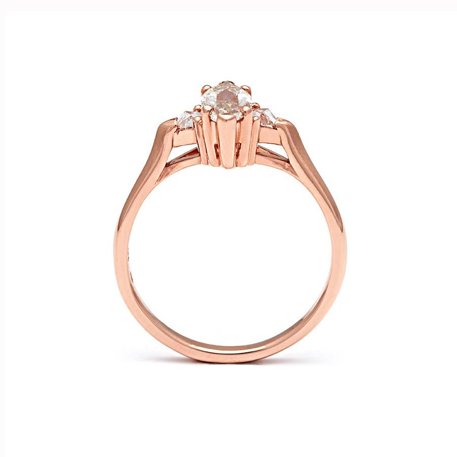 Approximately 0.50ct rose cut champagne diamond center, 0.15ctw white diamond trillions set in 14k recycled rose gold.

The Marquise Bea Three Stone ring features a stunning rose cut marquise champagne diamond which is set in an A.S. ceremonial