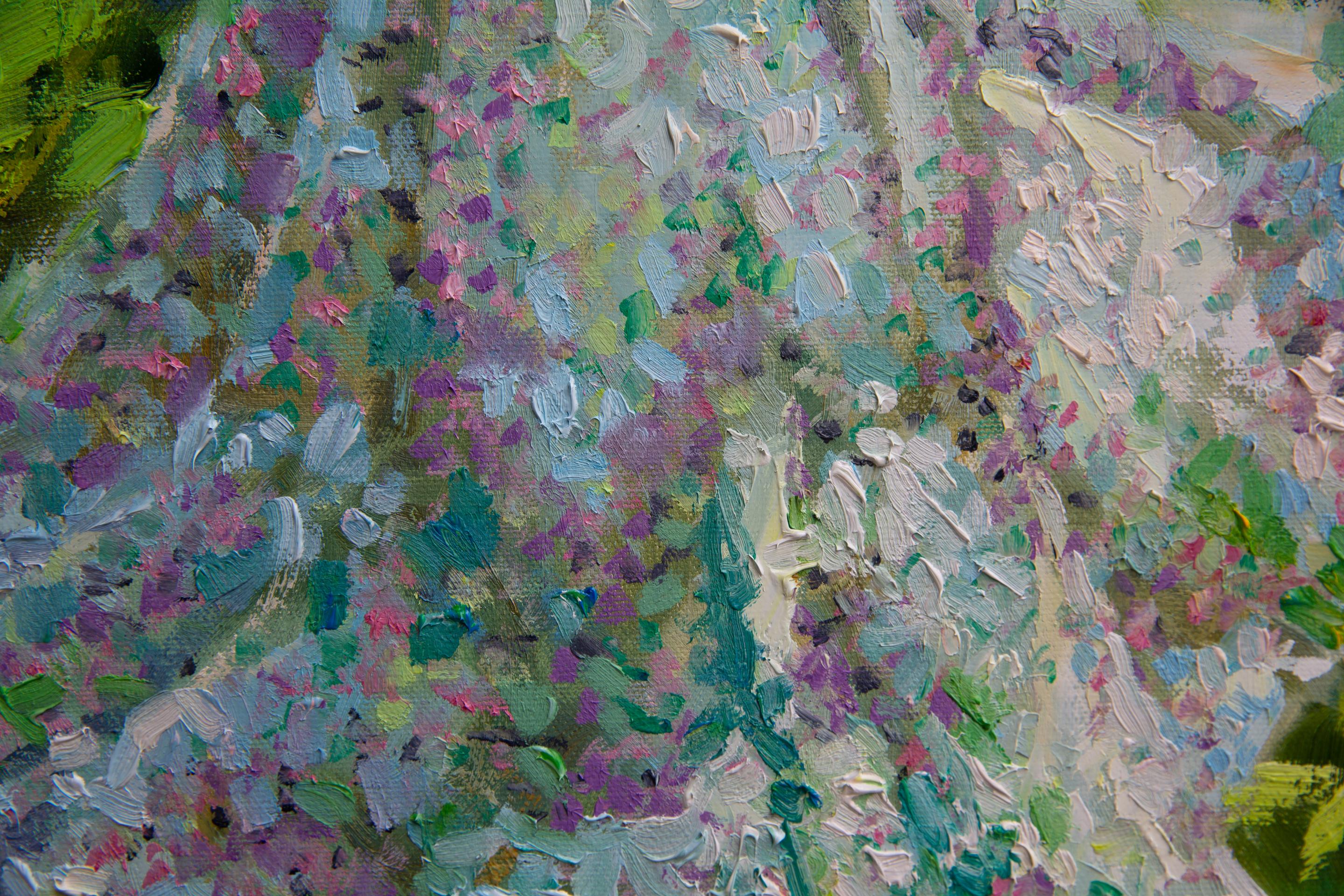 A beautiful girl in a beautiful summer dress admires a small flower in a blooming meadow. And the girl herself looks like a flower, born for life and the beauty of the world! The feeling of harmony and joy in being emerges with every brush