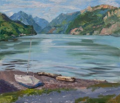 Tranquility on the Shore.  Horizontal, lake, mountains, boat, blue