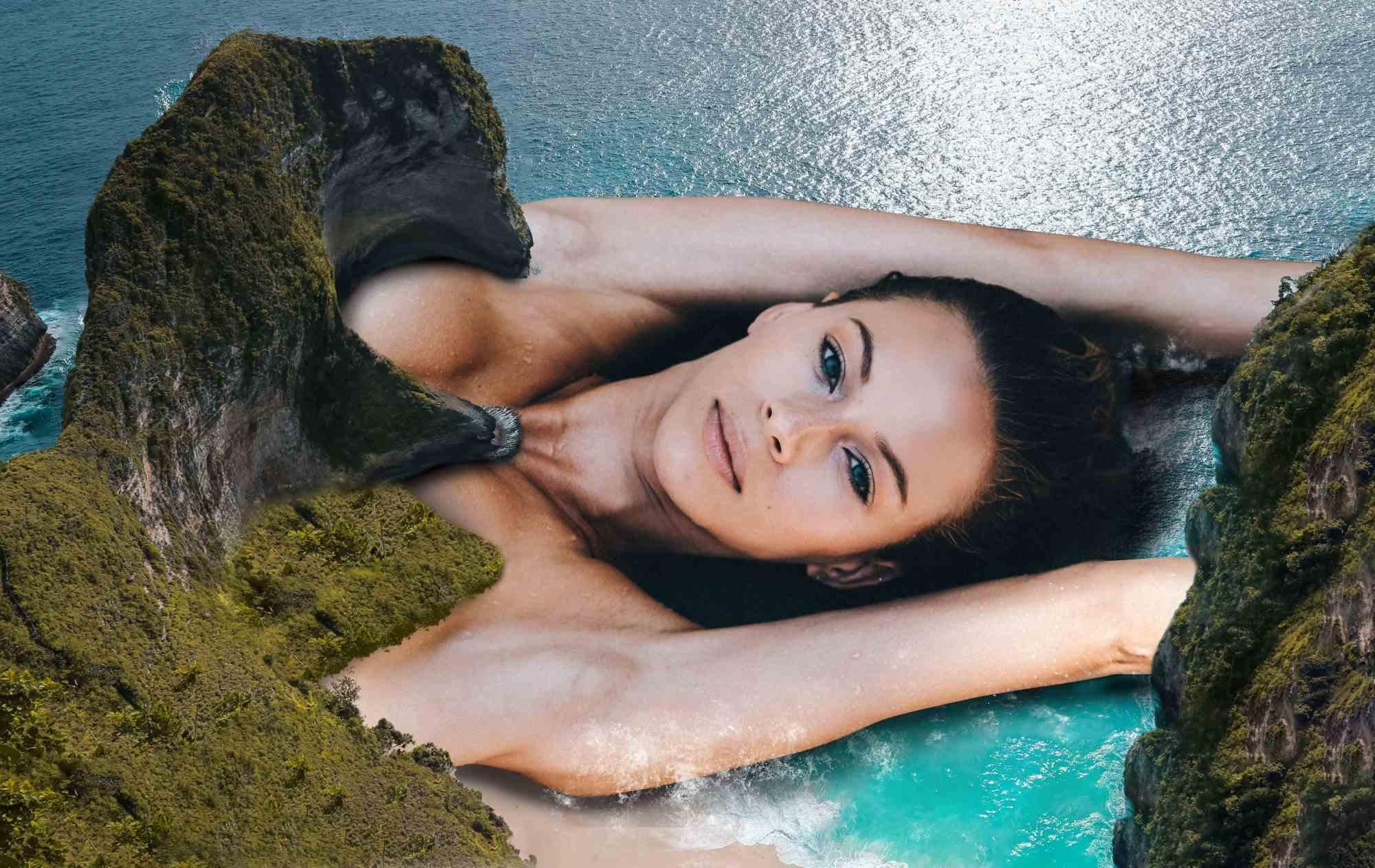 En medio de la isla de los dinosaurios de Indonesia, una mujer descansa, eclipsando en tamaño a su entorno. Su presencia suscita admiración, un testimonio de la magnificencia de la feminidad. Mientras las olas rompen cerca de ella, simboliza la