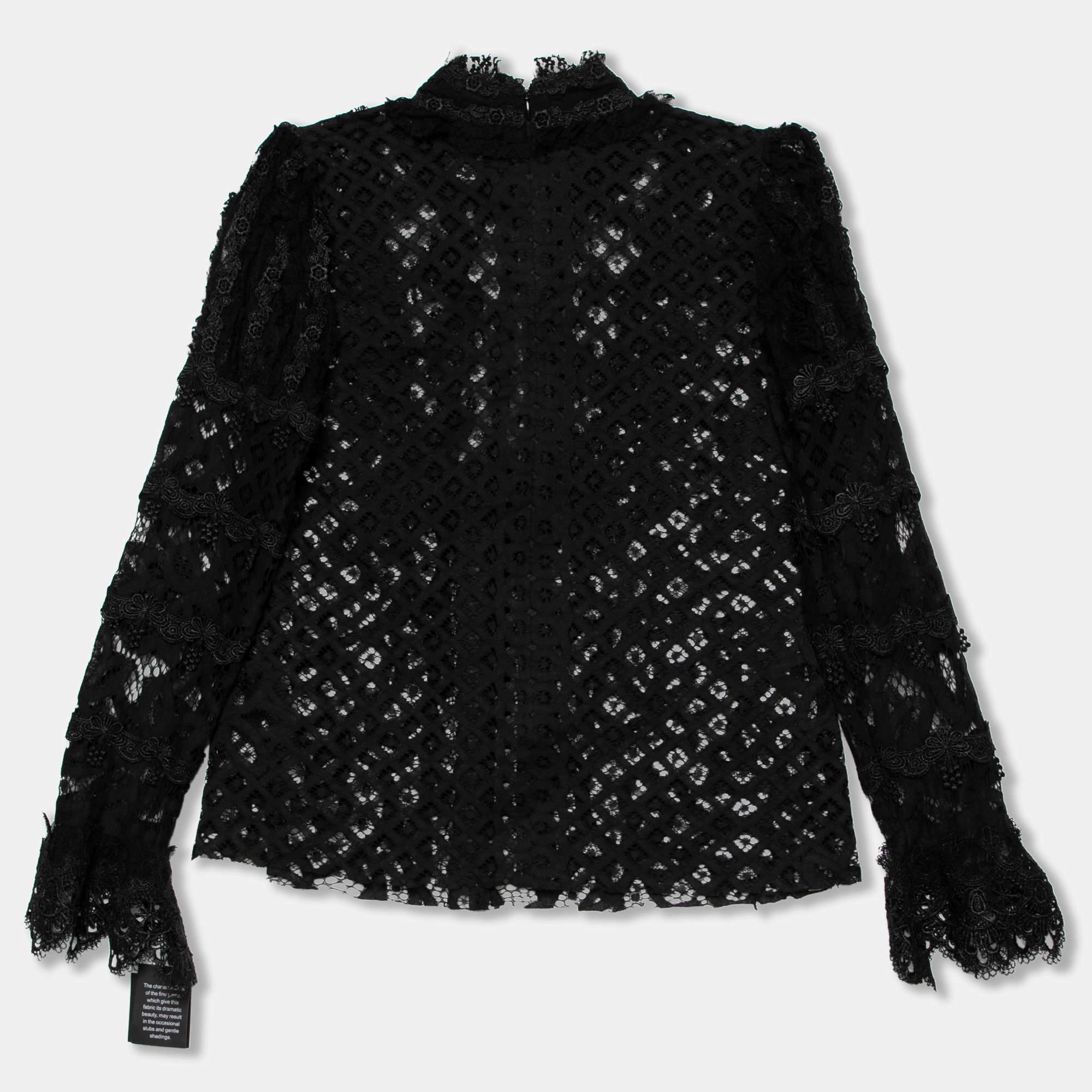 The intricate and attractive lace detailing make this Anna Sui blouse desirable. Tailored from a mix of quality materials it features long sleeves ruffled trims and a zipper closure. Pair it with a skirt or pants for a stylish appearance.