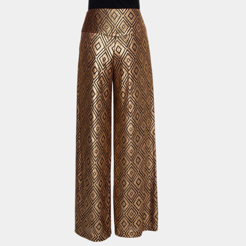 Comfort with the right element of statement style. Designed by Anna Sui, the high-waist trousers feature a wide-leg silhouette, zip closure, and geometric patterns all over.

