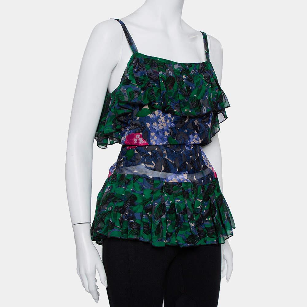 What an amazing sight this top brings! The Anna Sui silk creation flaunts a sleeveless style with slender shoulder straps, tie fastening at the rear, and ruffles. The top will give you a beautiful look when you wear it with structured pants and