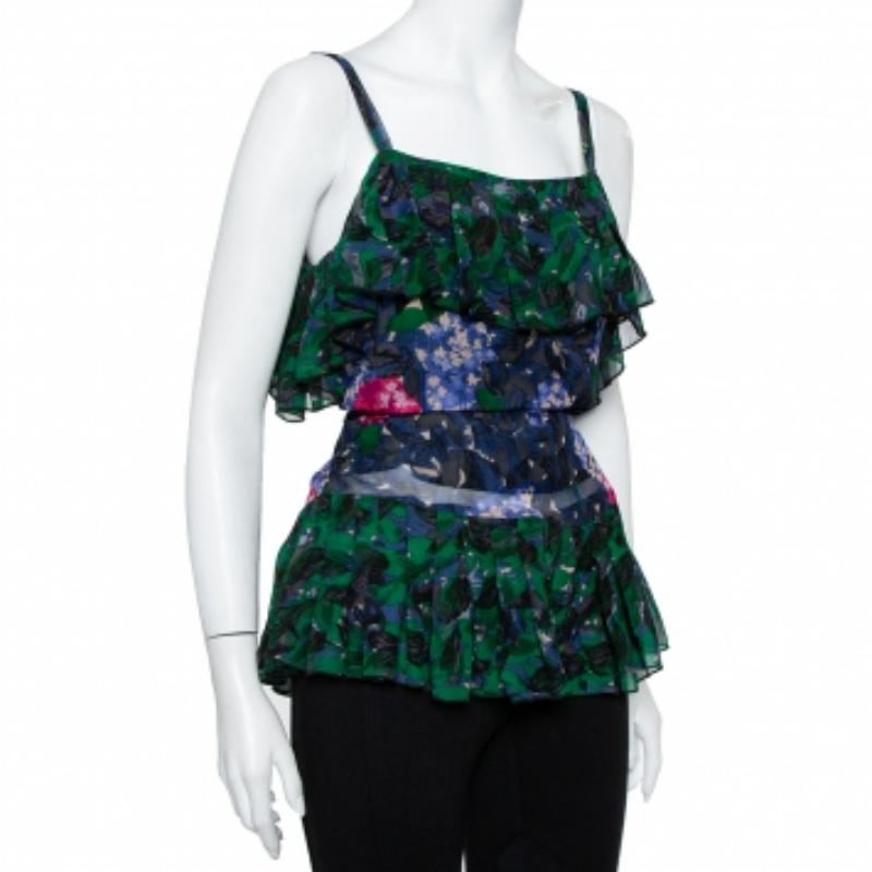 What an amazing sight this top brings! The Anna Sui silk creation flaunts a sleeveless style with slender shoulder straps, tie fastening at the rear, and ruffles. The top will give you a beautiful look when you wear it with structured pants and