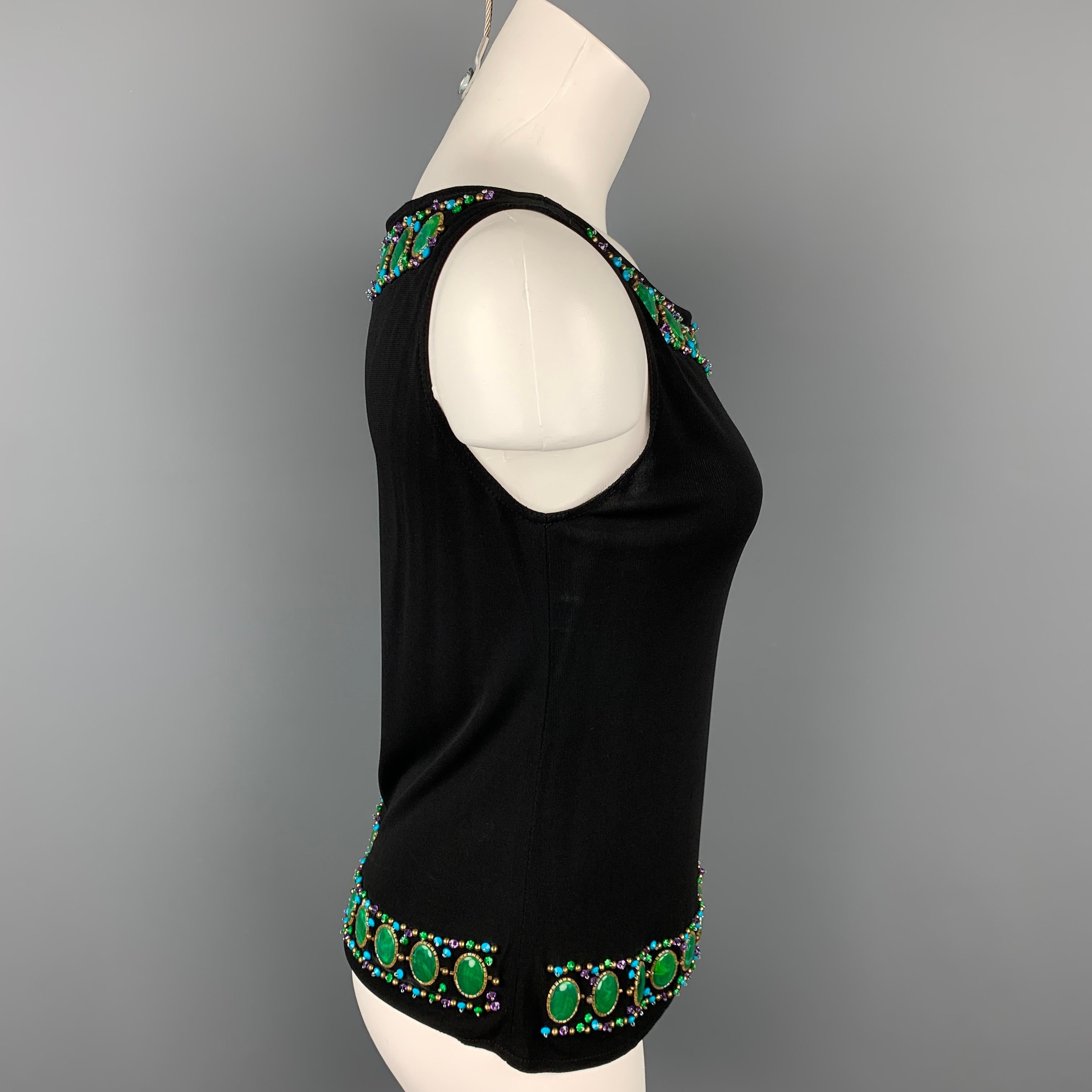 ANNA SUI tank dress top comes in a black rayon featuring a beaded trim design and a boat neck. Made in USA.

Very Good Pre-Owned Condition.
Marked: 6

Measurements:

Shoulder: 12.5 in.
Bust: 30 in.
Length: 21 in. 