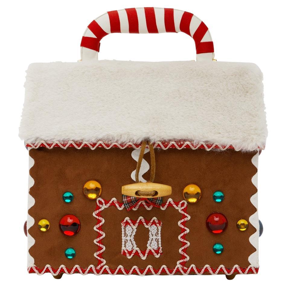 ANNA SUI x  Jerry Schwartz Limited Edition Gingerbread House Bag
Handcrafted suede top handle bag in brown.  Limited edition released on occasion of 25th anniversary of iconic original Gingerbread Handbag (Fall 1998; see photos). Beaded and