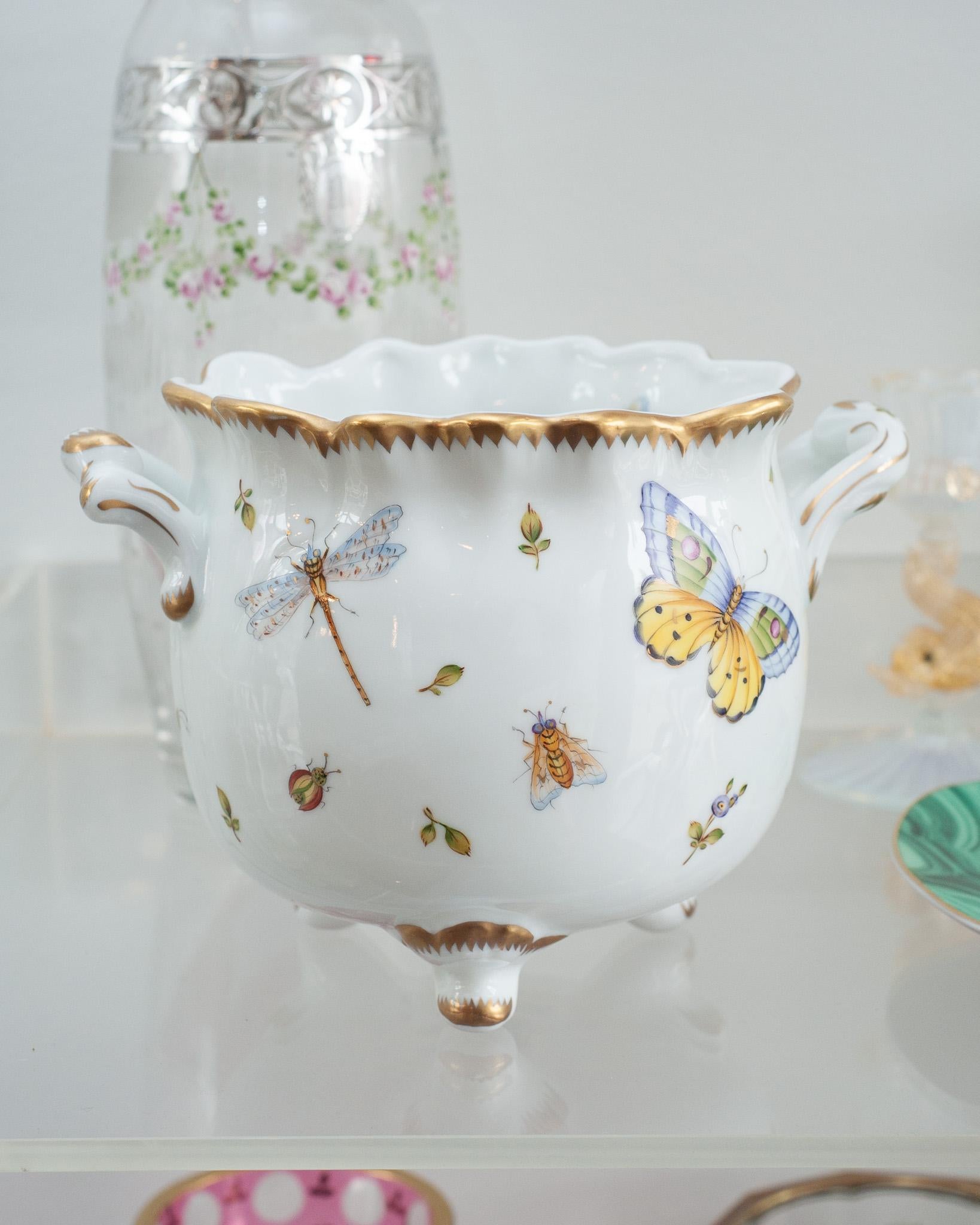 A beautiful hand painted footed cachepot / planter with handles, by Anna Weatherley Designs. Featuring hand painted butterflies, insect and floral motifs. Anna Weatherley has been designing and producing Fine Botanical Hand Painted Porcelain in