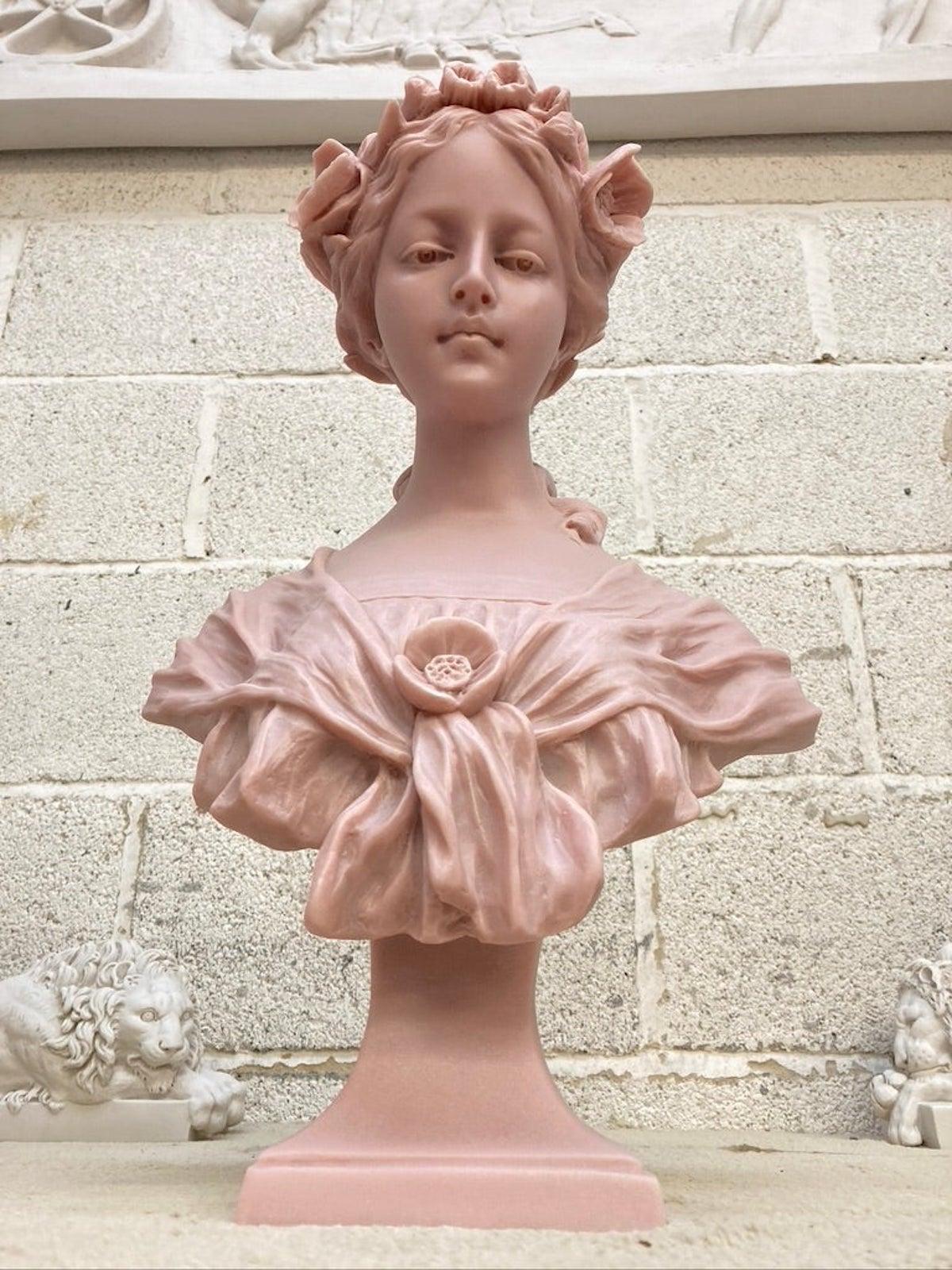 Annabel bust sculpture in pink marble, 20th century.

Annabel bust, a period portrait of a young lady.

Finished in a very soft pink marble.

A stunning portrait sculpture of a beautiful country girl, foliage and flowers adorn her head, crisp