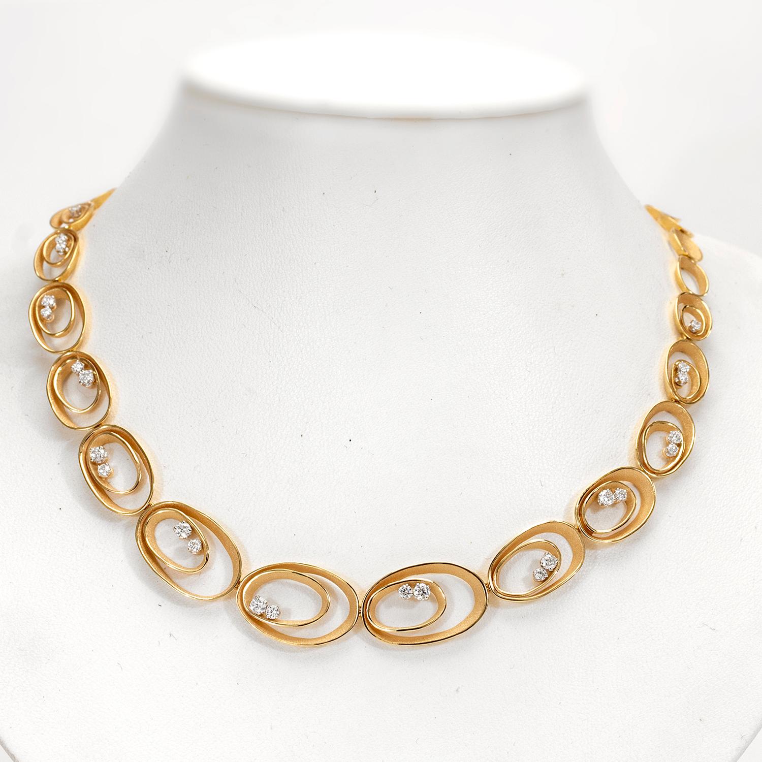From Annamaria Cammilli's Essential collection, Dune collar necklace handcrafted in 18 karat Apricot Orange gold. Twenty four brilliant white diamonds at 1.29 carat total weight. Thirty one oval links taper from largest link in the center to
