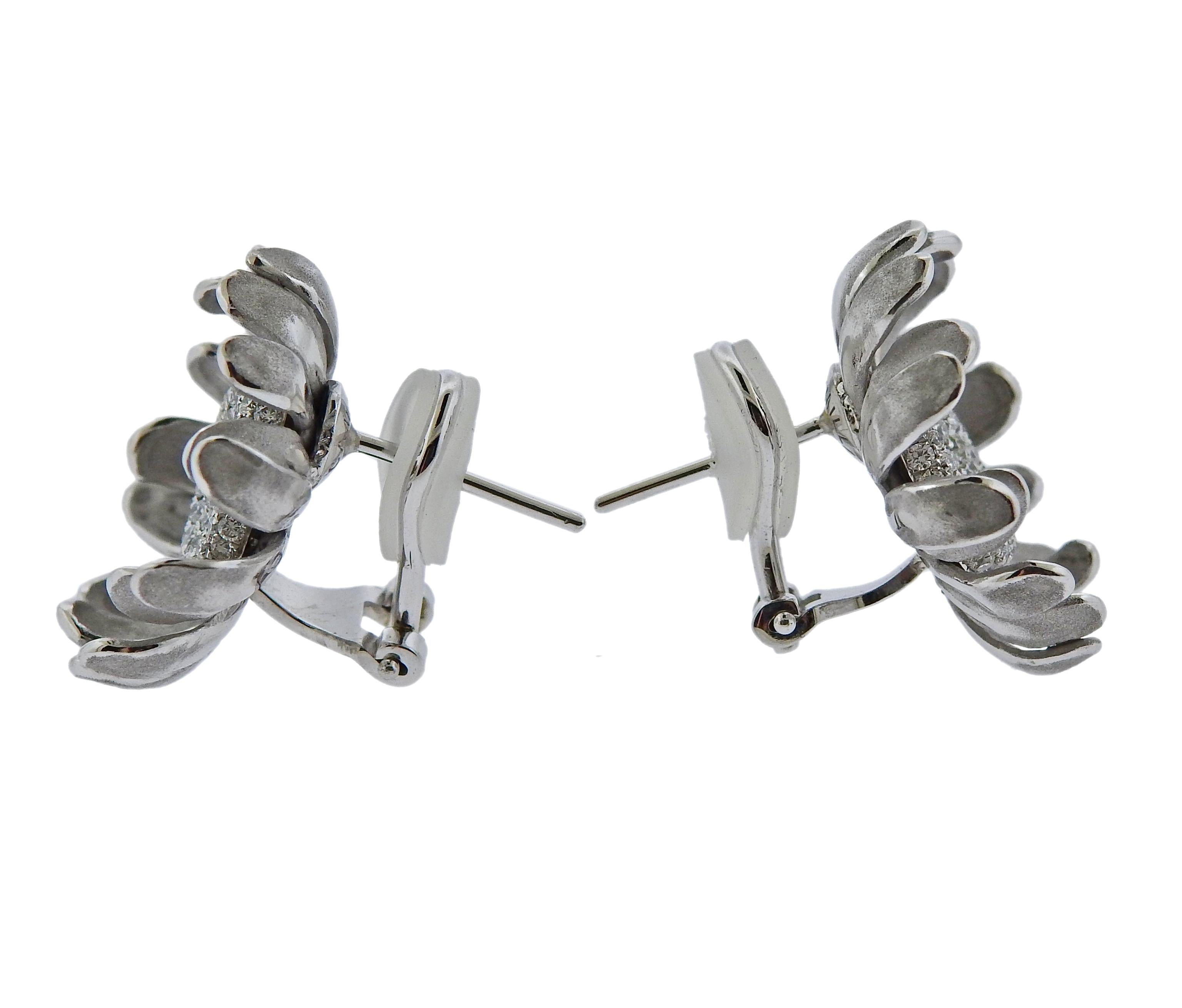 Pair of brand new 18k white gold Prelude flower earrings by Italian designer Annamria Cammilli, set with 1.04ctw in GH/VS diamonds. Come with box and COA, retail $10300. Earrings measure 21mm in diameter. Weight is 12.9 grams. Marked: 901 FI, 750,