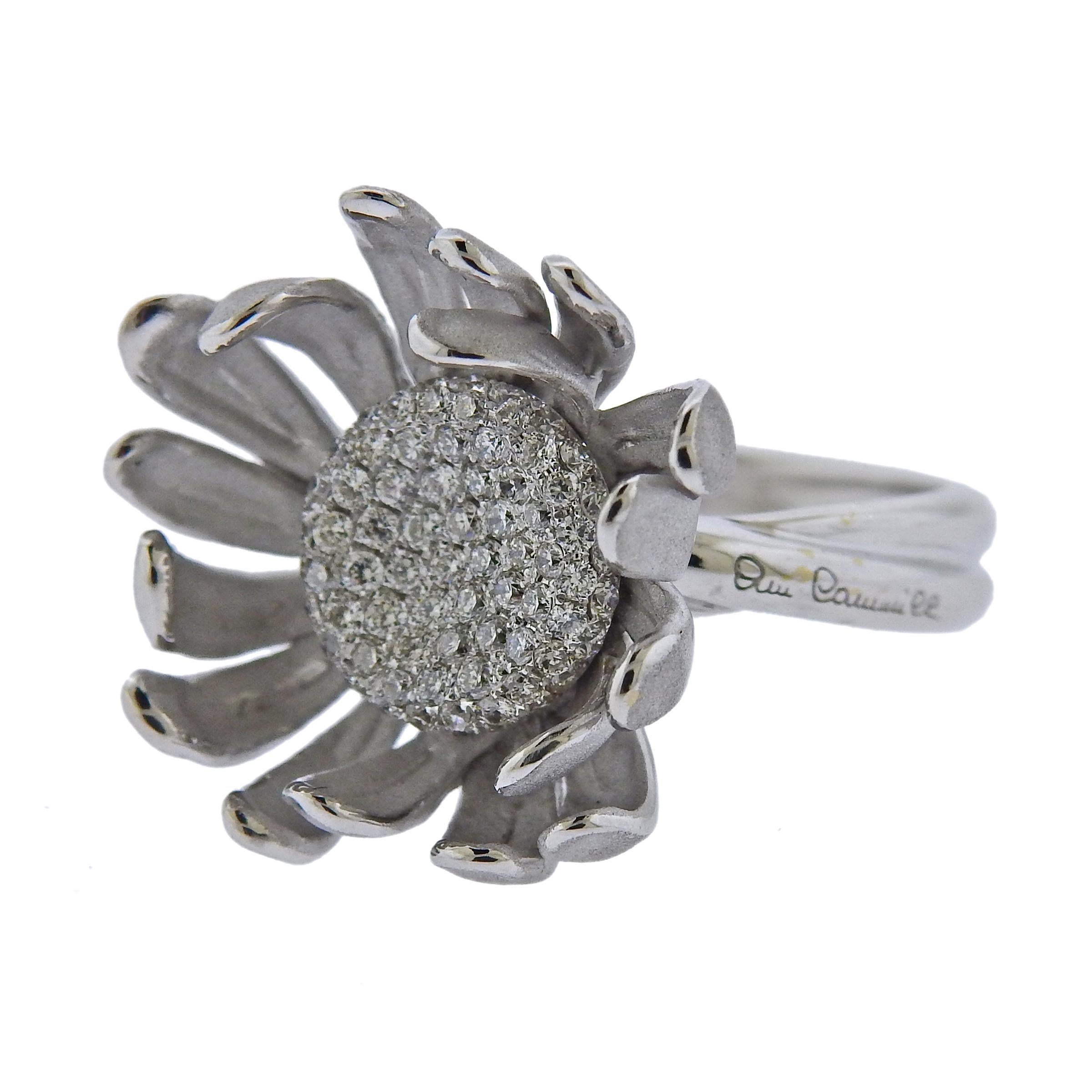 Pair of brand new 18k white gold Prelude flower ring, by Italian designer Annamria Cammilli, set with 0.59ctw in GH/VS diamonds. Comes with box and COA, retail $9410. Ring size - 7, ring top - 23mm in diameter.  Weight is 9.3 grams. Marked: 750,