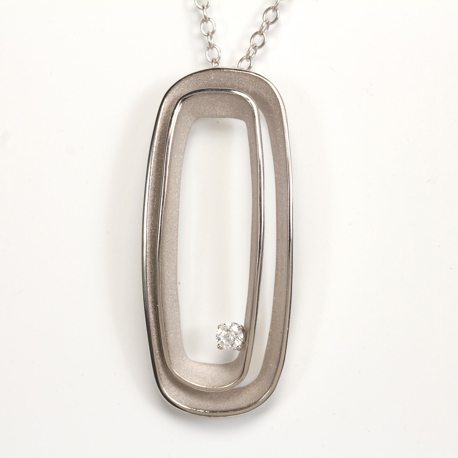 From Annamaria Cammilli's Serie Uno collection, large rectangle shaped pendant necklace handcrafted in 18 karat Ice White  gold. Two layers of polished and satin textured gold, with a diamond nested between layers. Diamond weight is 0.15 carat.