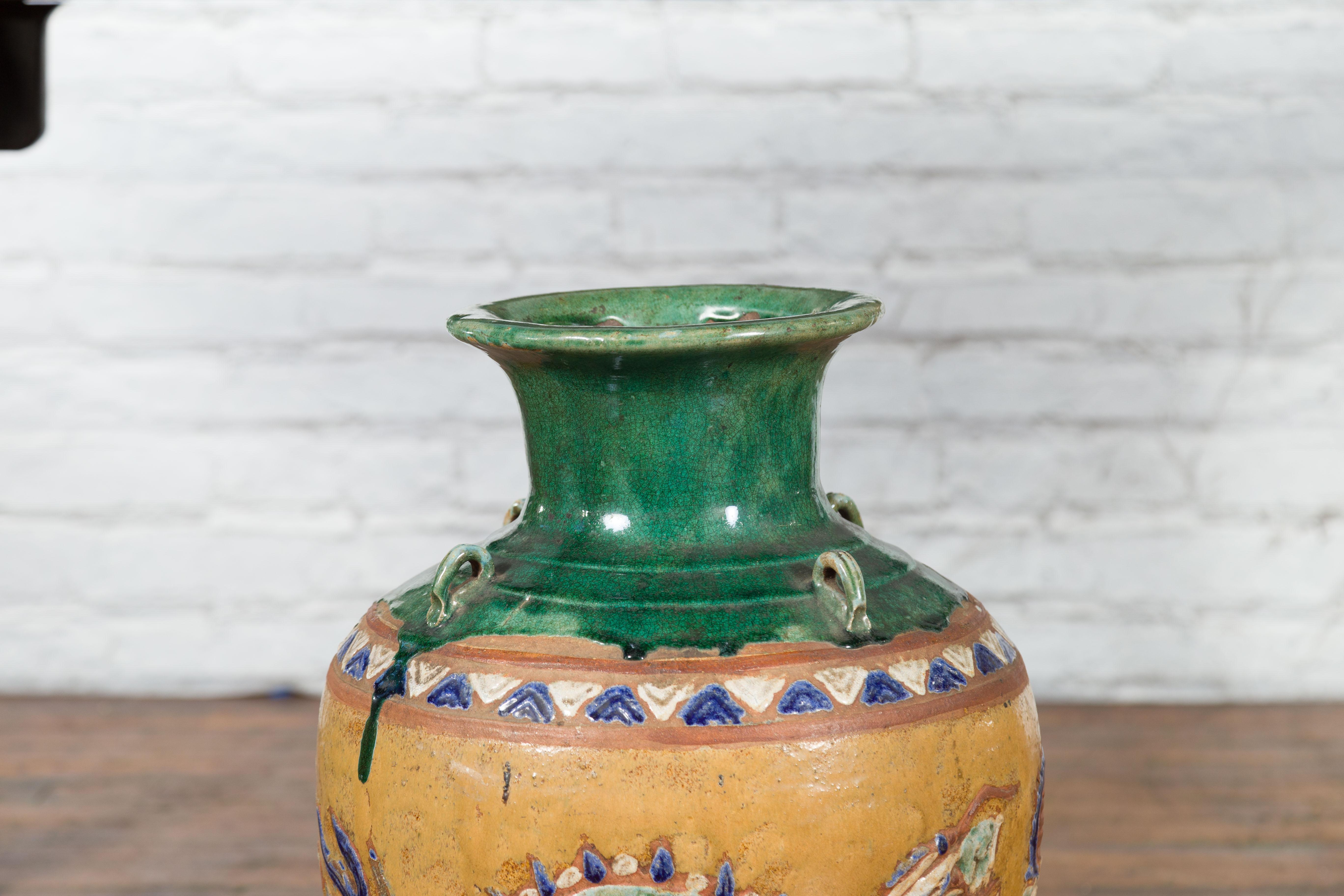Ceramic Annamese 19th Century Green Glazed Water Jar with Raised Dragon Motifs For Sale