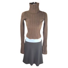 AnnDemeulemeester 1996 Set in lana Maglia a coste a collo alto e taglio sbieco Gonna a vita bassa