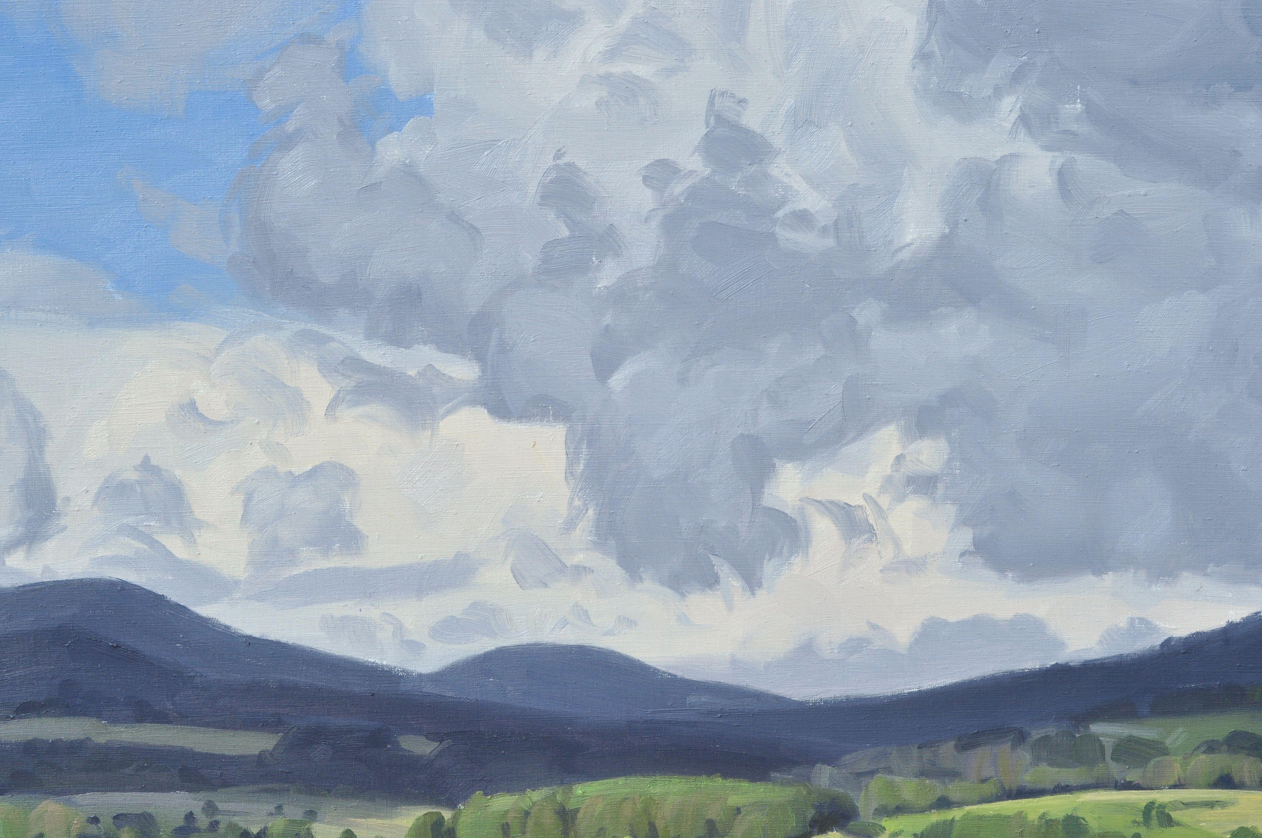 Paysage d'Auvergne, France. Vue de mon Studio.    Le ciel dominant occupe la majeure partie de la toile, nous enveloppant dans son immensité. Le grand format de la toile apporte une dimension immersive, avec ses imposantes masses nuageuses qui