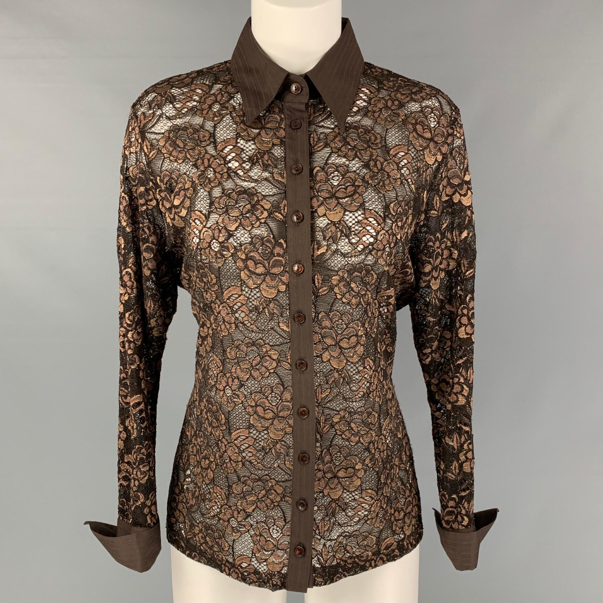 ANNE FONTAINE 3/4 sleeves shirt comes in a brown and gold lace featuring a straight collar, and button down closure. Made in France.

Very Good Pre-Owned Condition. Minor sign of wear. Fabric tags removed.
Marked: 5

Measurements:

Shoulder: 17