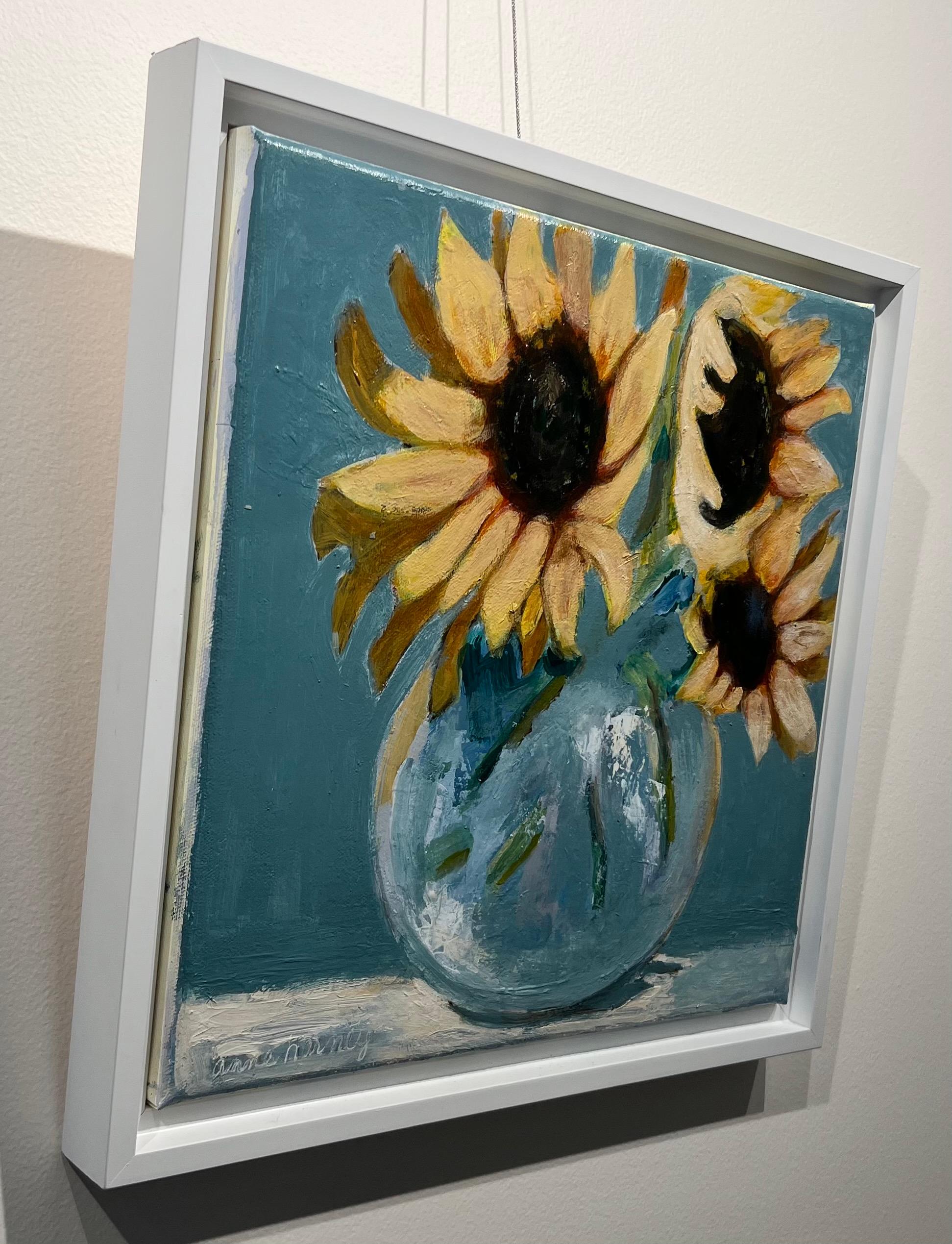 vase with five sunflowers