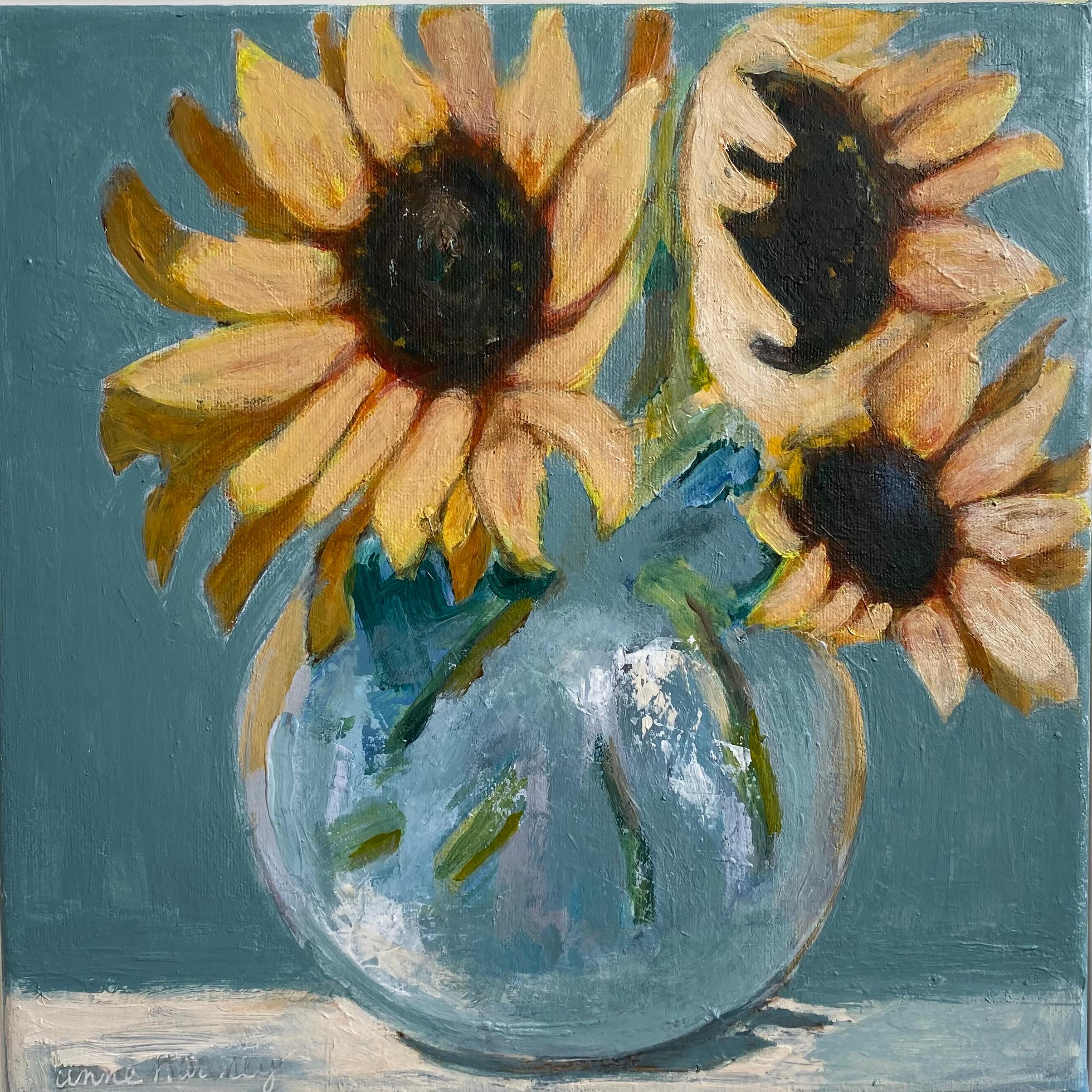Anne Harney Still-Life Painting - "Sunflowers II" Still-Life painting of bright yellow sunflowers in a clear vase.