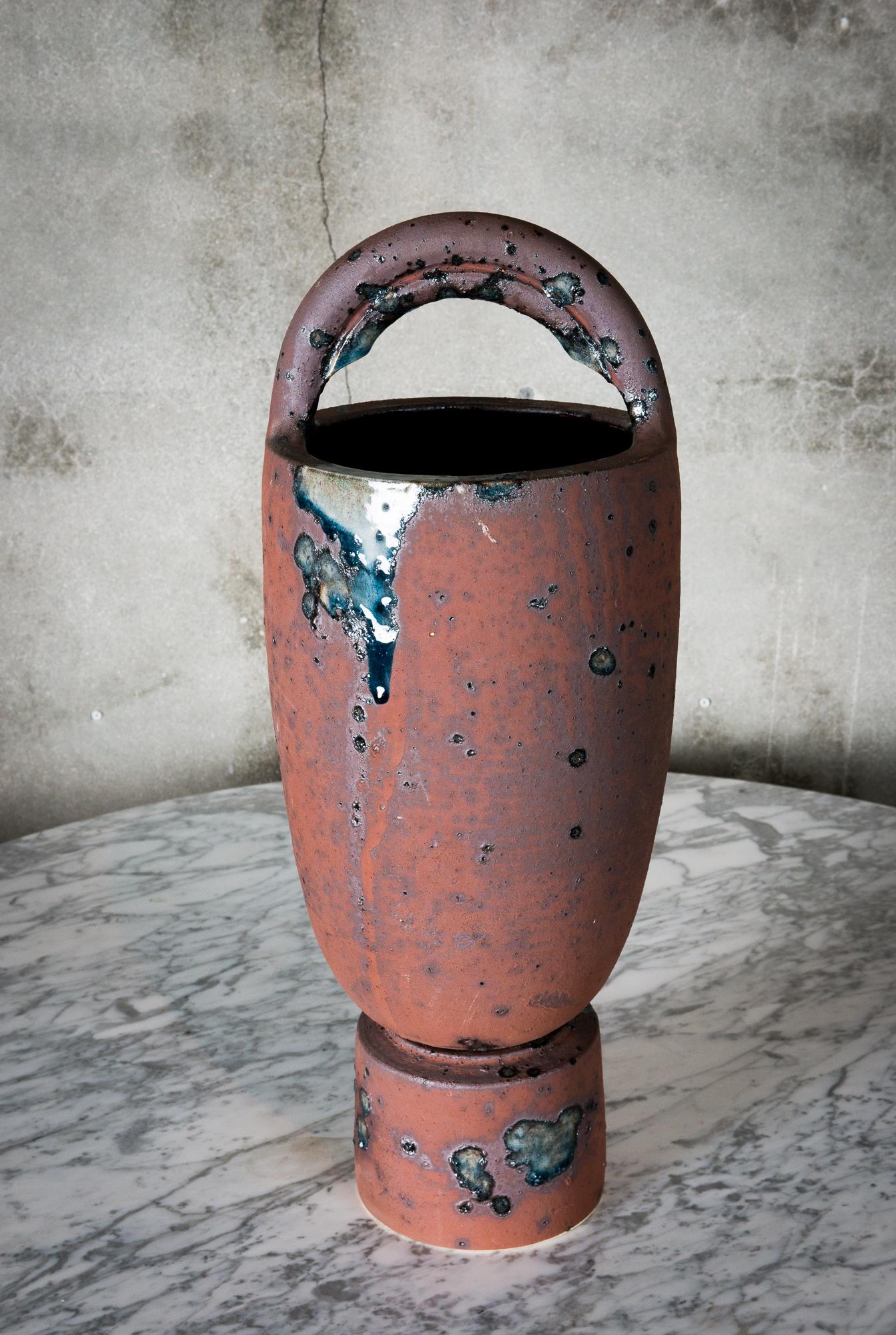 A tall stoneware vase with stand by Anne Hirondelle, signed.