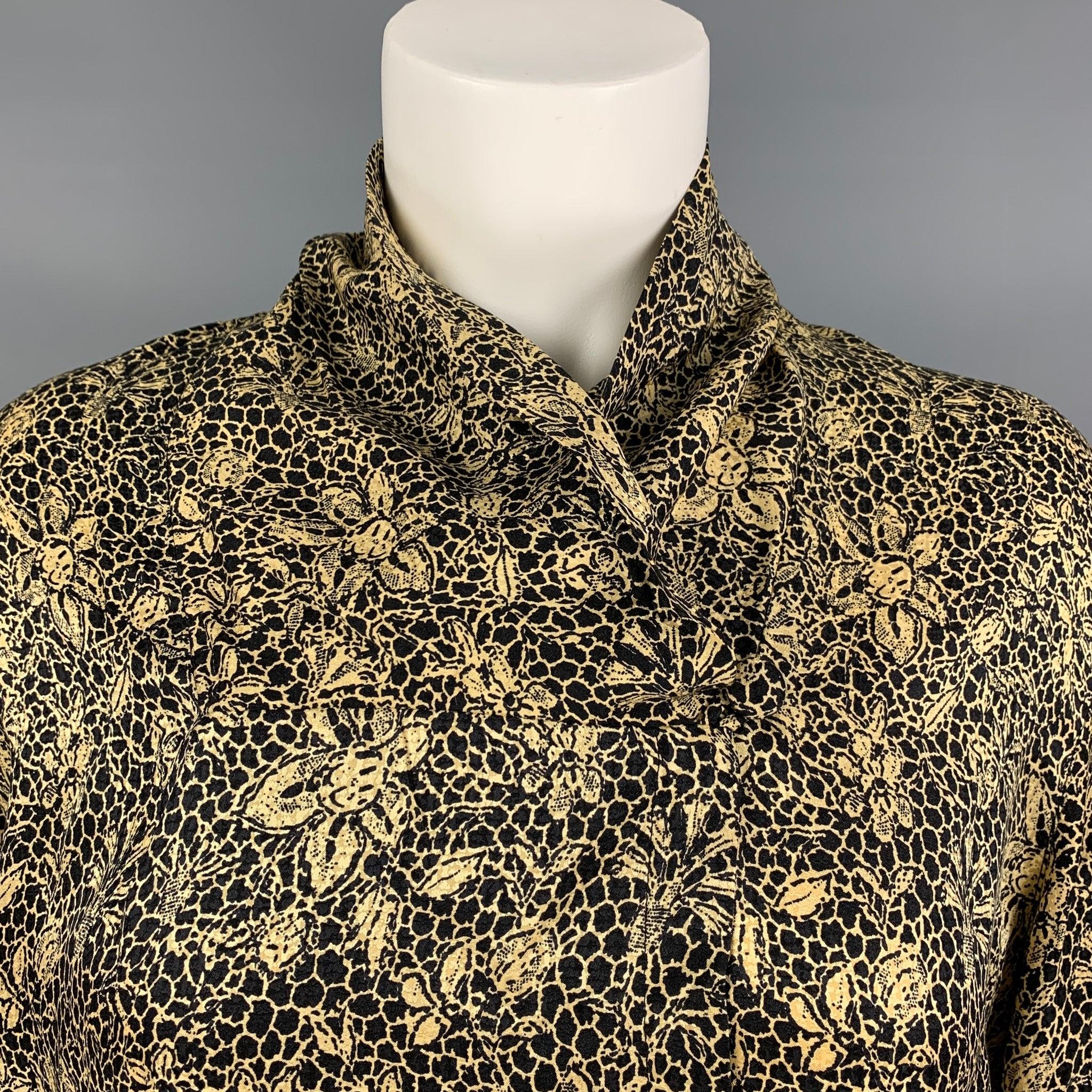 ANNE KLEIN long sleeves blouse comes in a black abstract floral silk fabric featuring single button closure. Made in USA.Excellent Pre-Owned Condition.  
 

 Marked:  6 
 

 Measurements: 
  
 Shoulder: 17 inches Bust: 42 inches Sleeve: 25 inches
