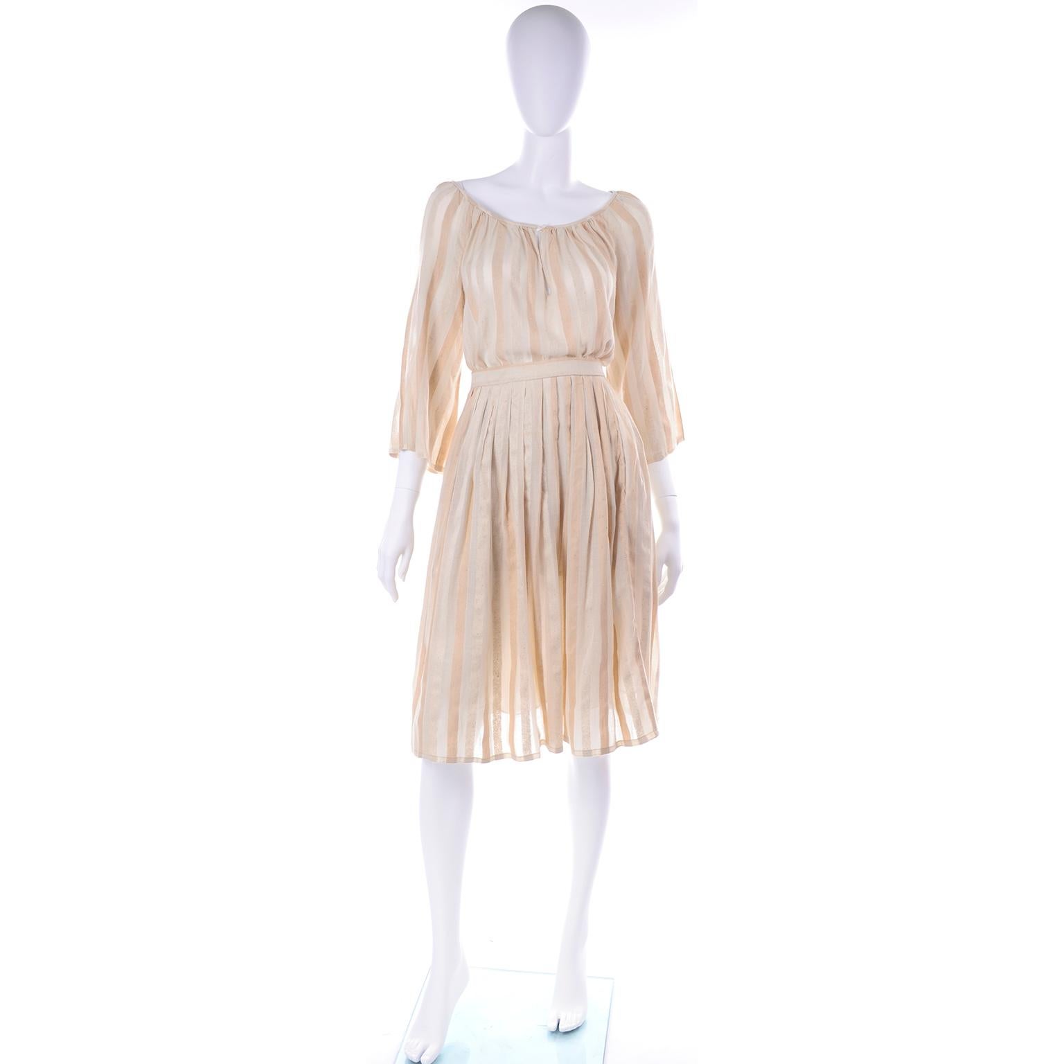 This is a really wonderful vintage 1970's Anne Klein 2-Piece Dress in a tonal striped natural linen and raw silk. This dress was made in USA (Union label) and is marked a size 8. The dress closes with a Waistband hook-and-eye and a metal zipper down