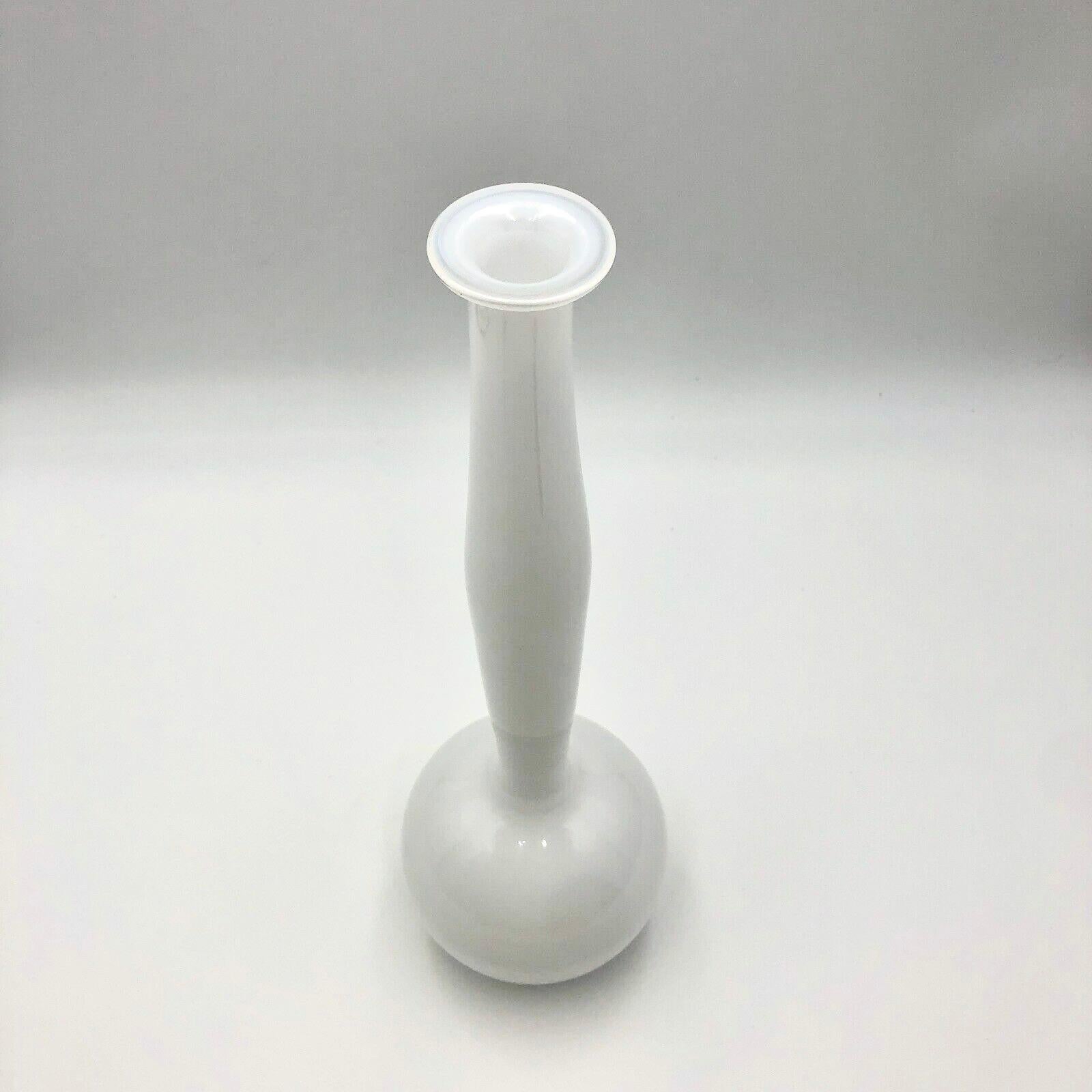 Rare signed and numbered Anne Nilsson for Orrefors Expo 1998 white glass vase.  This beautifully crafted clear and white glass vase is approximately 16.5