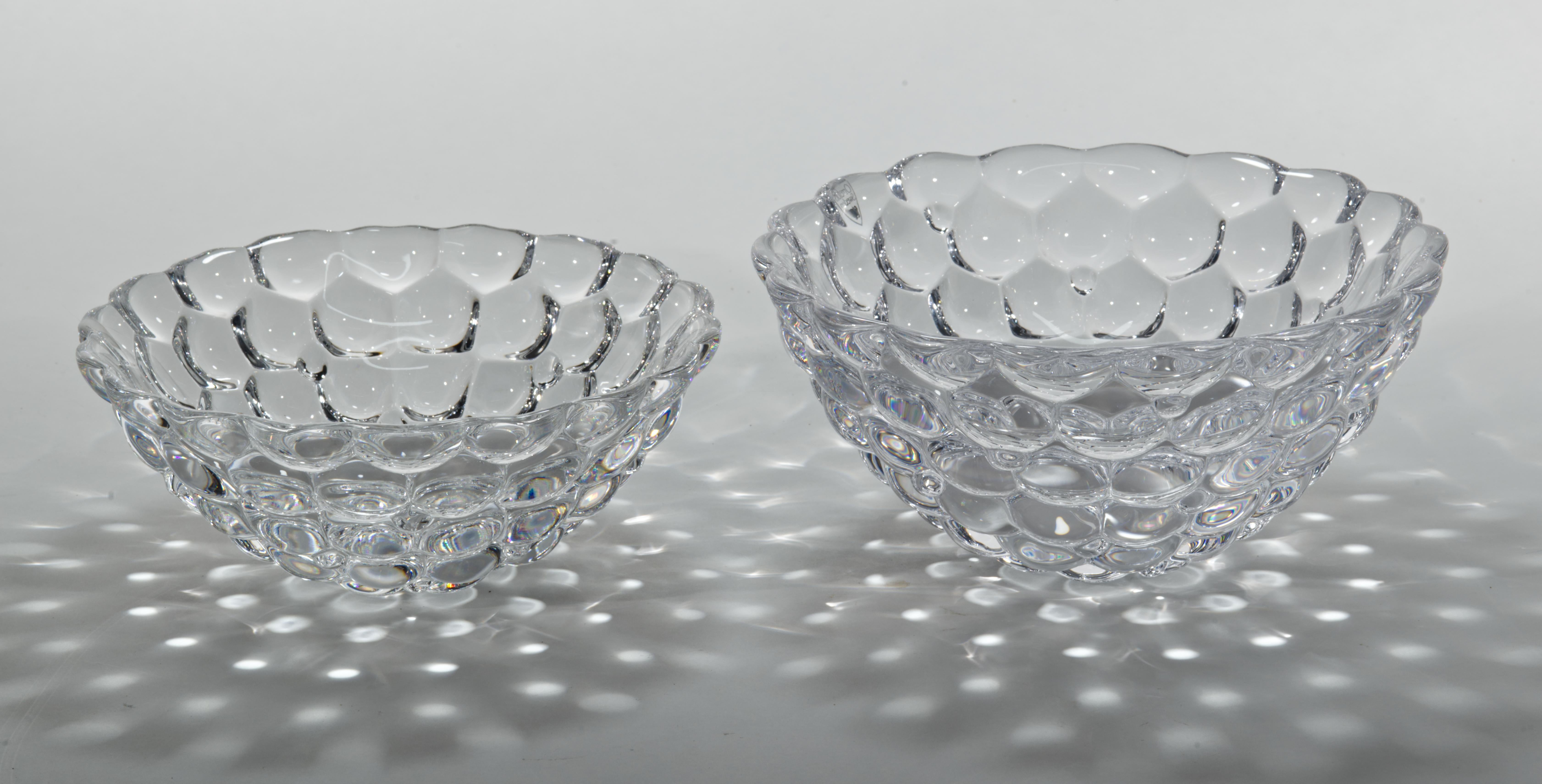 Raspberry is a collection of clear crystal bowls, vases, votive candle holders and a plate, that was designed by Anne Nilsson for Orrefors in 1992. The round balls resemble a raspberry, with its round ‘drupelets’ giving it a soft look. 

The set of