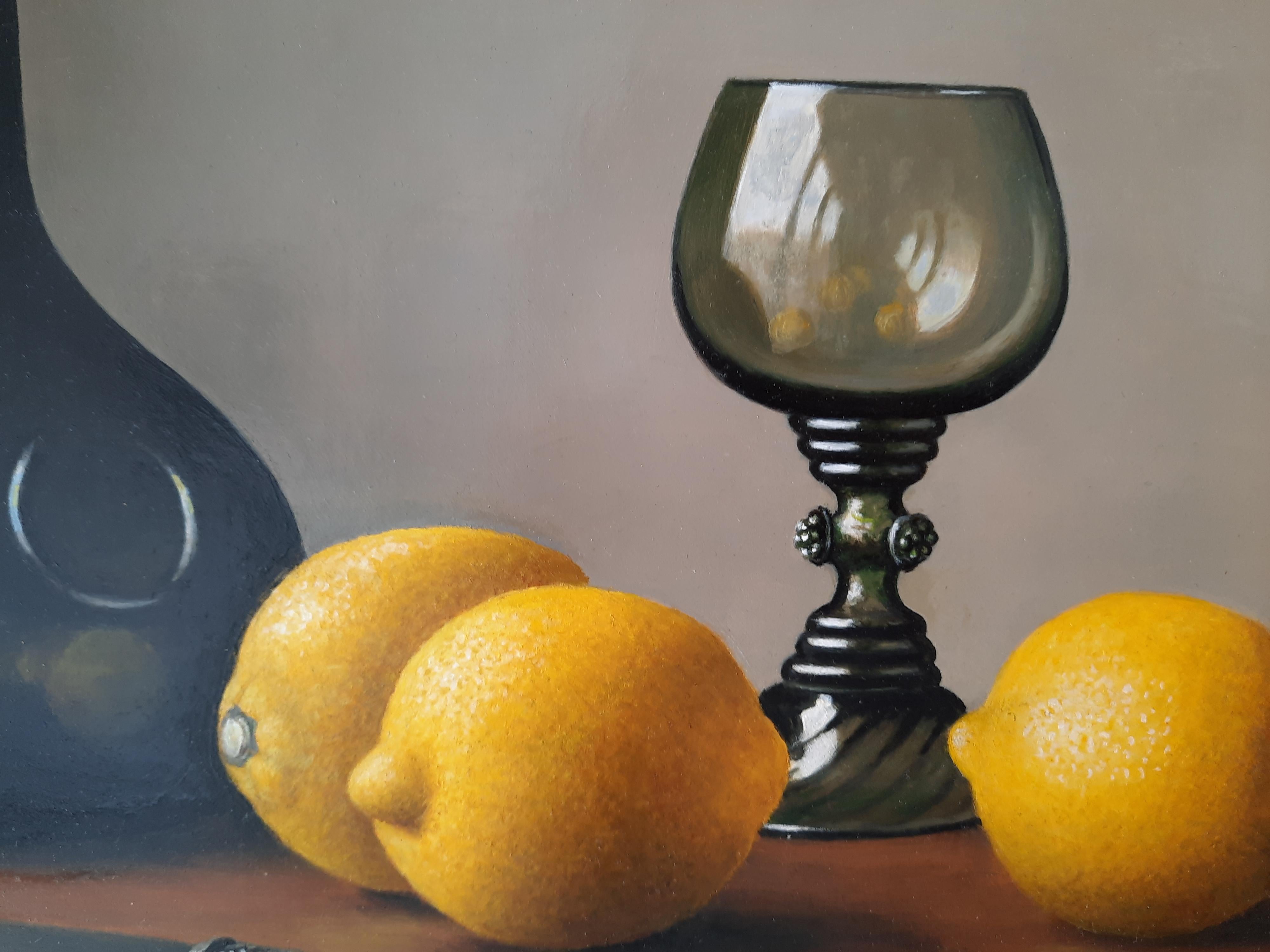 still life with wine glass and cut lemon