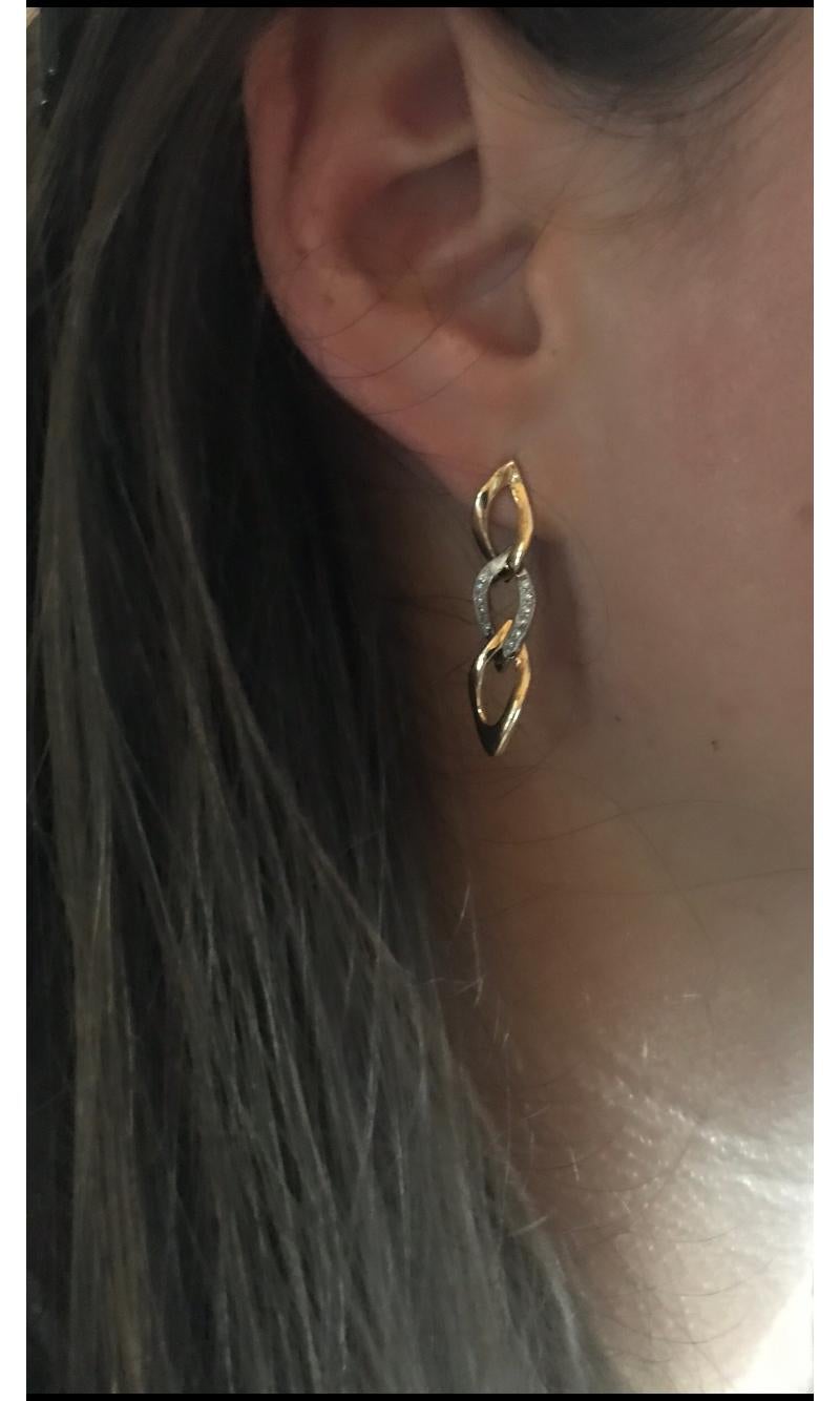 Further details:
18kt White Gold
24 G-VS White Diamonds
Able to make a matching necklace

A delicate pair of earrings created to be worn everyday with two White 18kt Gold links framing a central White Gold pair set with 24 White Diamonds. In the