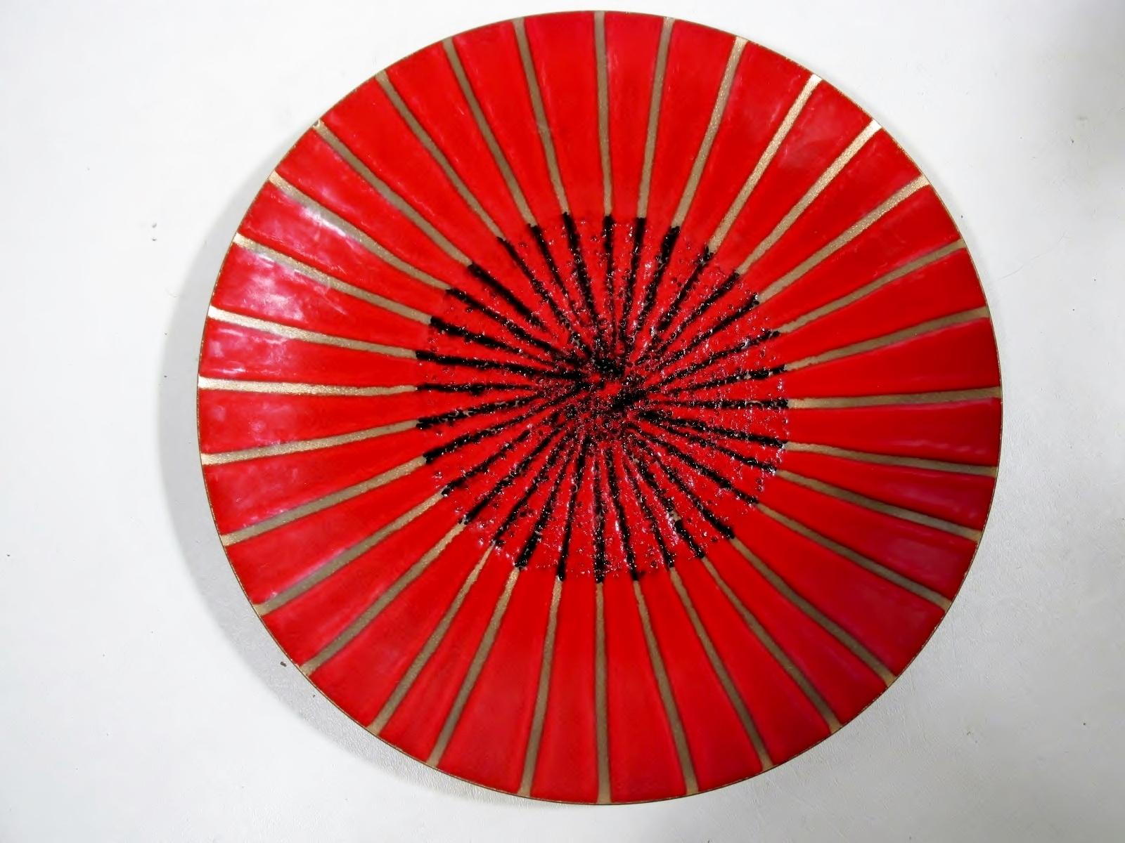 Unusual 11.75” diameter round modernist enamel on copper charger with an abstract starburst decoration by renowned California artisan Annemarie Davidson. 

Condition is excellent overall showing light use scuffing and no chips, cracks, repairs, or