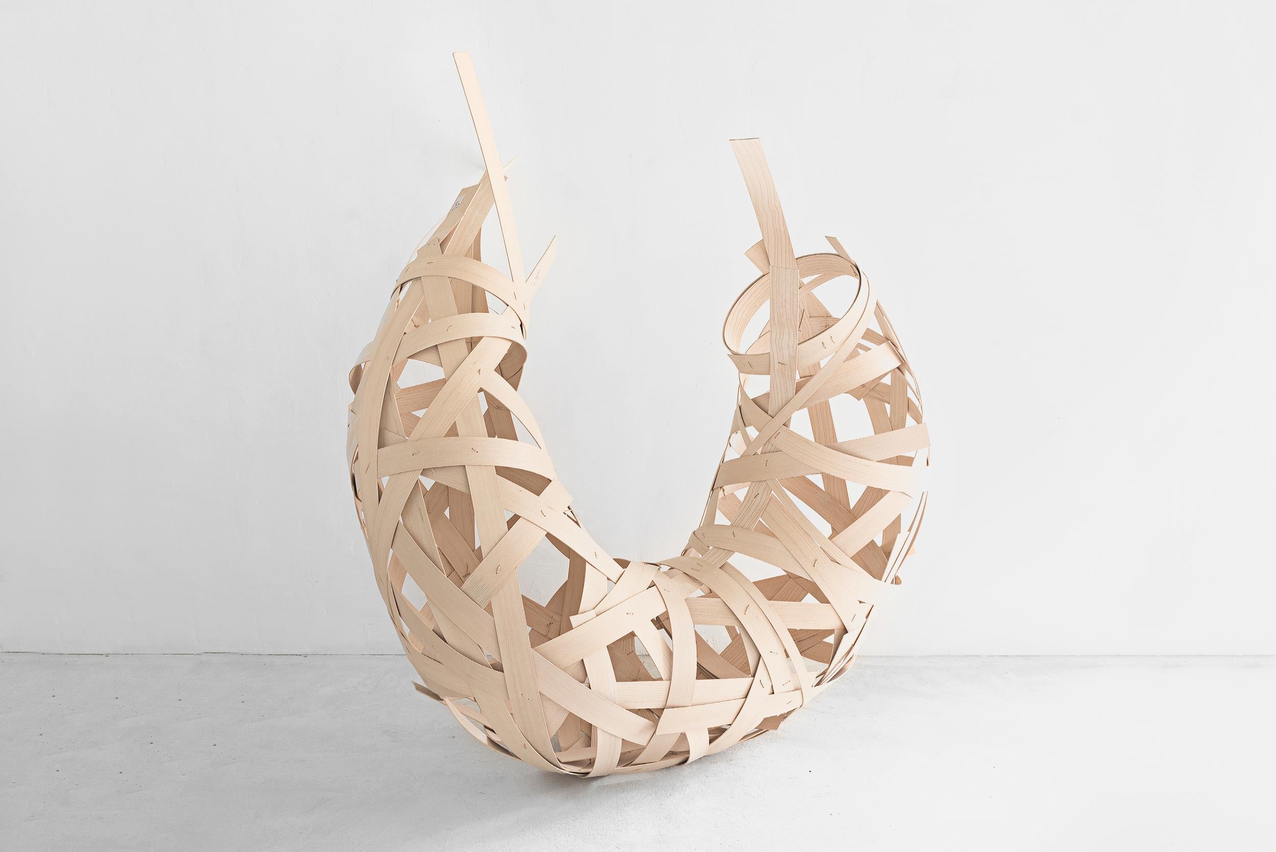Annemarie O´Sullivan
Curl
Manufactured by Annemarie O´Sullivan
England, 2019
Finger jointed ash and cane”

Measurements
150 cm x 200 cm height
59 in x 78,74 in height

Concept
Curl is one of Annemarie’s architectural woven forms. Working mainly with