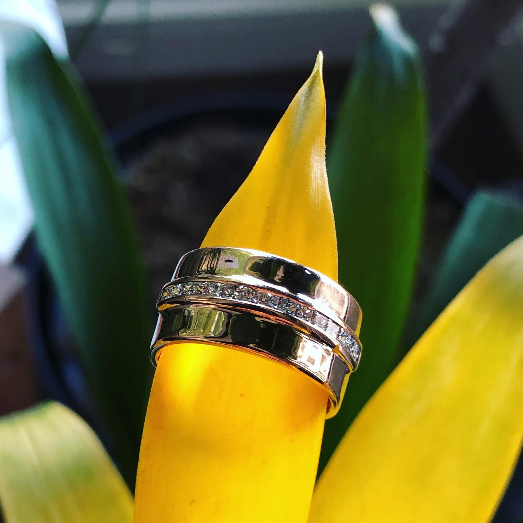 SELIN KENT's update on a classic cigar band. In 14k yellow gold with princess-cut diamonds that are individually channel-set for a brilliant display of everyday luxury.

Diamonds cover a little over half the band. 
Diamond carat weight is 0.55