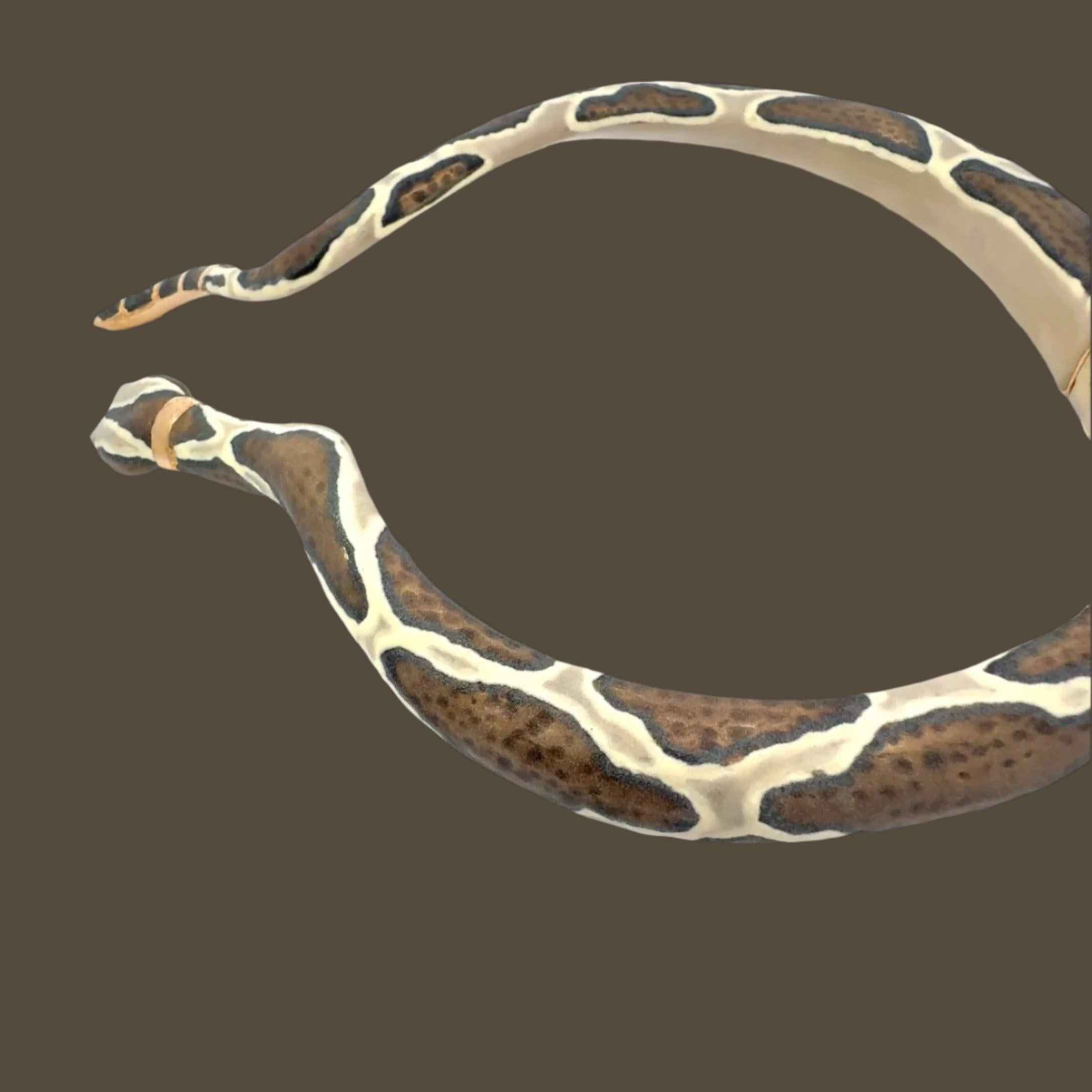 Feel powerful! Expertly handcrafted in Italy by skilled artisans, the Italian Serpente Enamel Statement Necklace features a dramatic snake design that gently hugs your neck for a truly unique and elegant look. Elevate any outfit with this