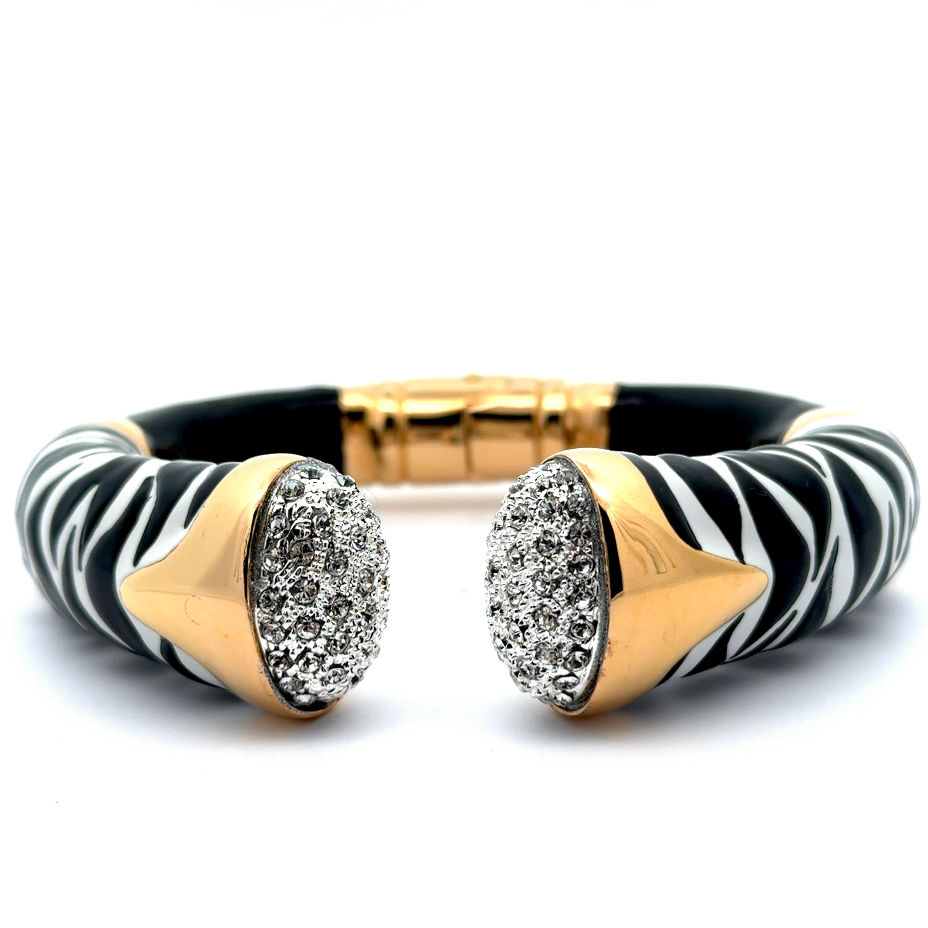 One of a kind statement piece! Experience the exquisite craftsmanship of Annibale Baldini with this Italian zebra statement bangle bracelet. Hand-crafted by skilled artisans, its bold black and white zebra motif makes a striking statement. Add a