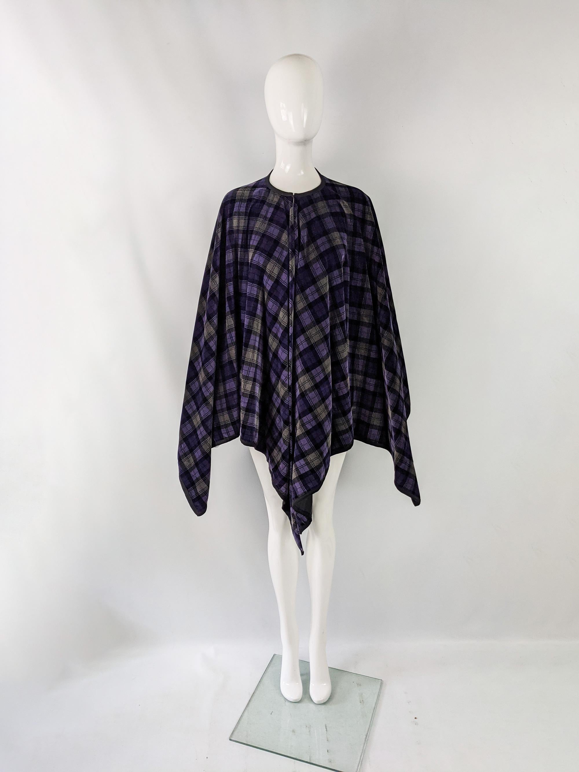 A fabulous vintage womens cape from the 70s by British boutique designer, Annie Gough. Made from yards of a tartan / plaid checked velvet which gives it a full look, with a single hook and eye at the neck. 

Size: Marked vintage UK 14 but really one