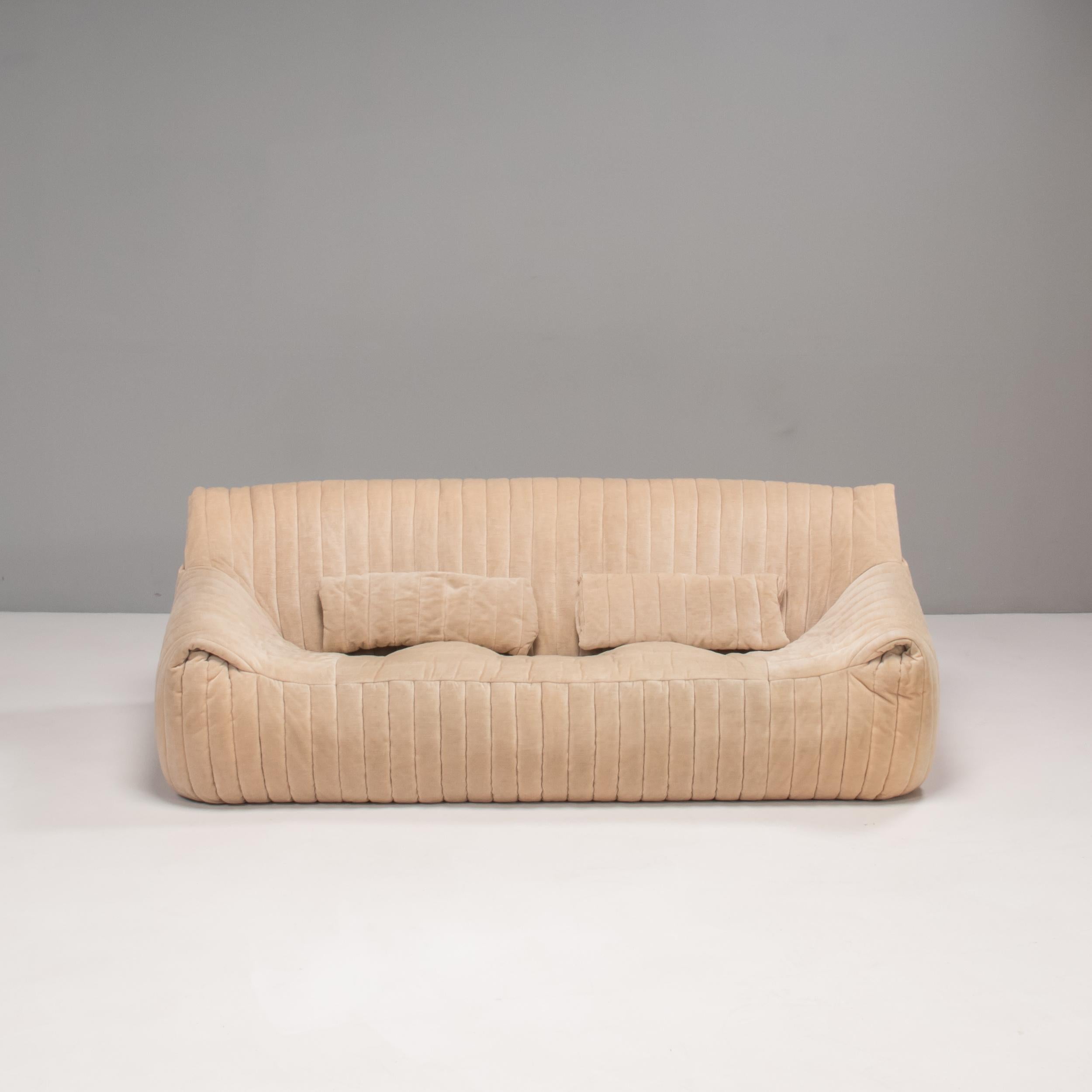 An iconic 1970s design, the Sandra sofa was designed by Annie Hiéronimus for Cinna after she joined the Roset Bureau d'Etudes in 1976.

Constructed from foam, the sofa has a solid form which is fully upholstered in soft biscuit beige ribbed