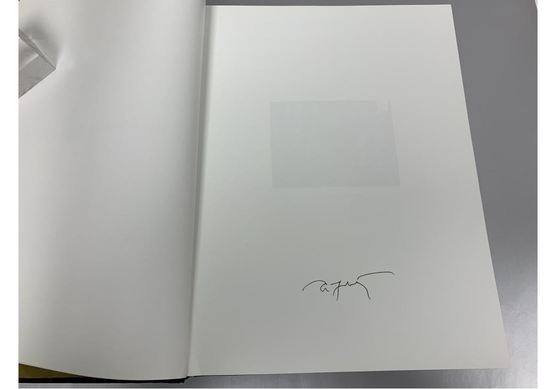 Hardbound book Annie Leibovitz Portraits 2005-2016, coffee table book  pictorial boards with acetate dust jacket, illustrated throughout, 316 pages.
Bank of America card affixed to bottom of front fly page. Signed on page 3.  Copyright 2017, Phaidon