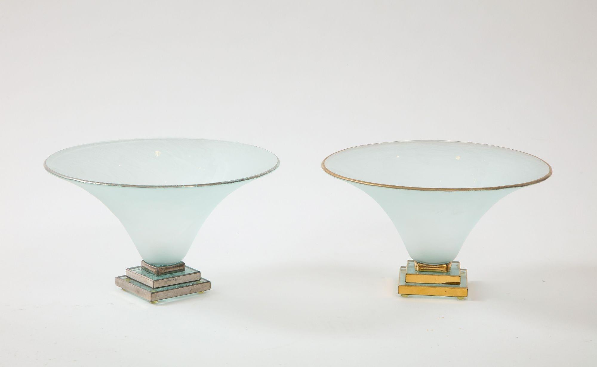 A wonderful set of two footed bowls in opaque glass on a tiered foot gilded in 24 kt gold and silver.