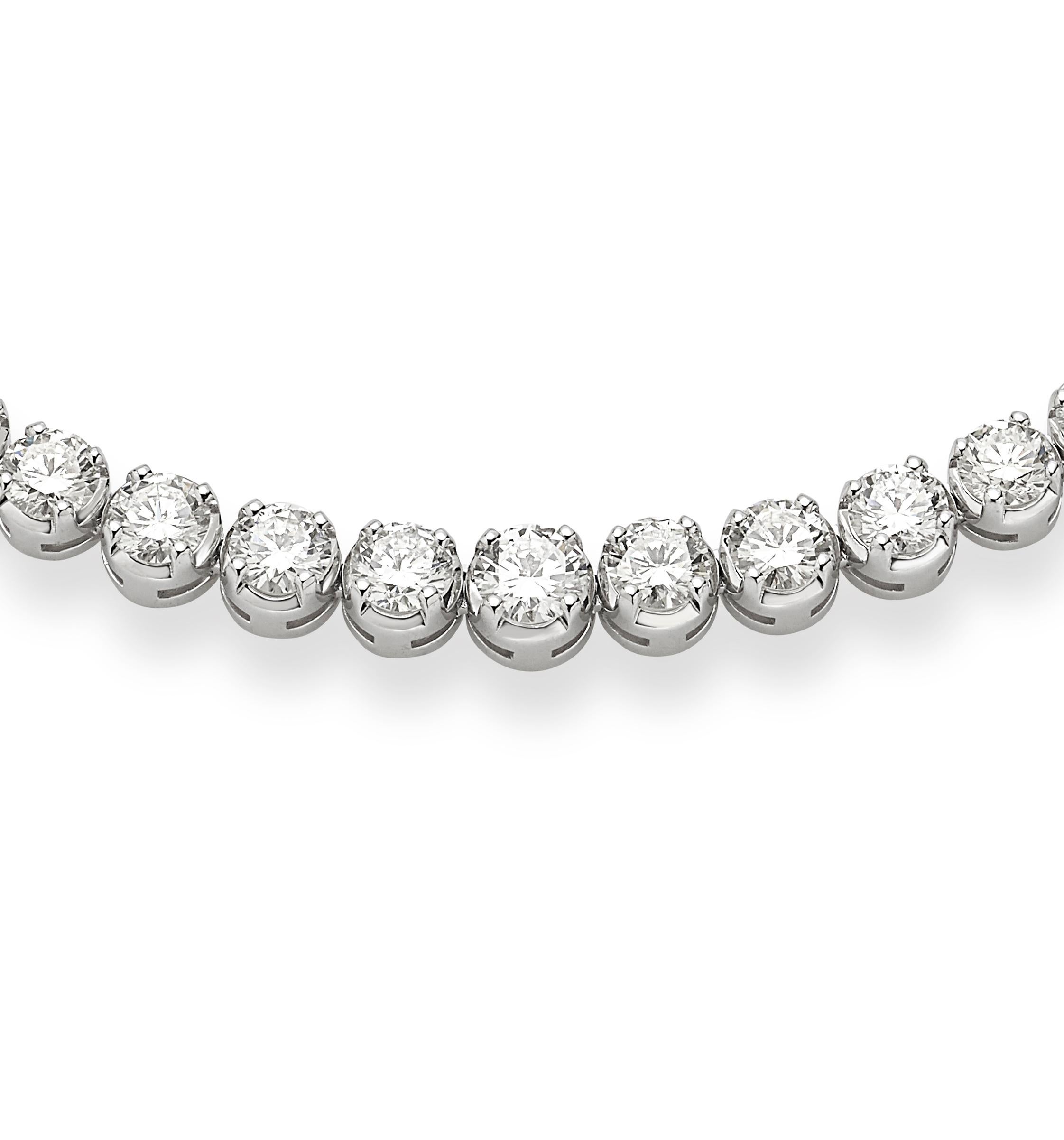 18 Karat White Gold Garavelli Diamond Tennis Necklace:
This gorgeous necklace is hand-made in Italy and has been made to celebrate our  company's 100 years anniversary 
It features a beautiful one carat center stone color H clarity VS1. Stone
