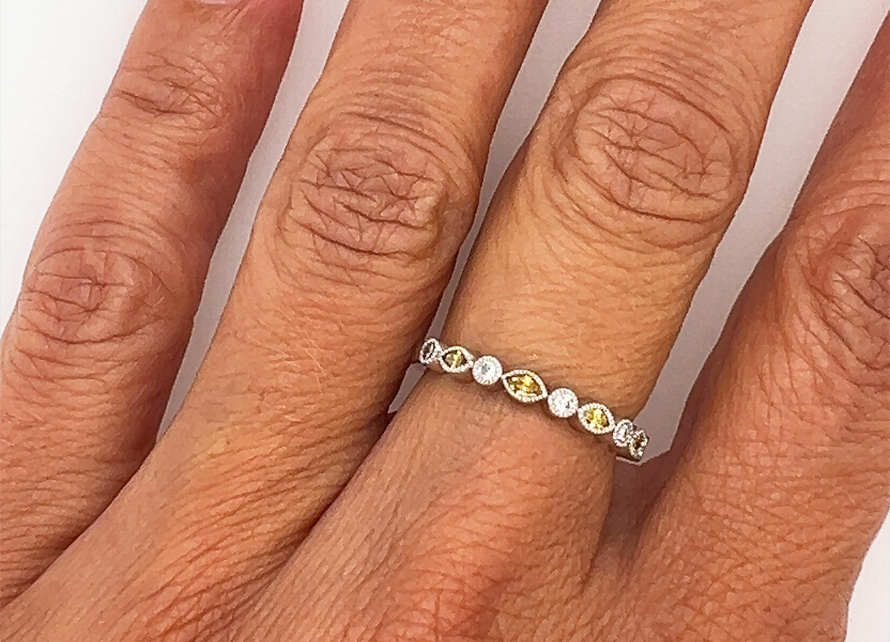 Brand New Anniversary Ring Alternating Pattern of Natural Fancy Vivid Deep Yellow Marquise Diamonds and Round Diamonds



Natural Mined Fancy Vivid Deep Yellow Diamonds Add Deep Rich Color 

Round Brilliant Diamonds Shimmer in Between

Great Band to
