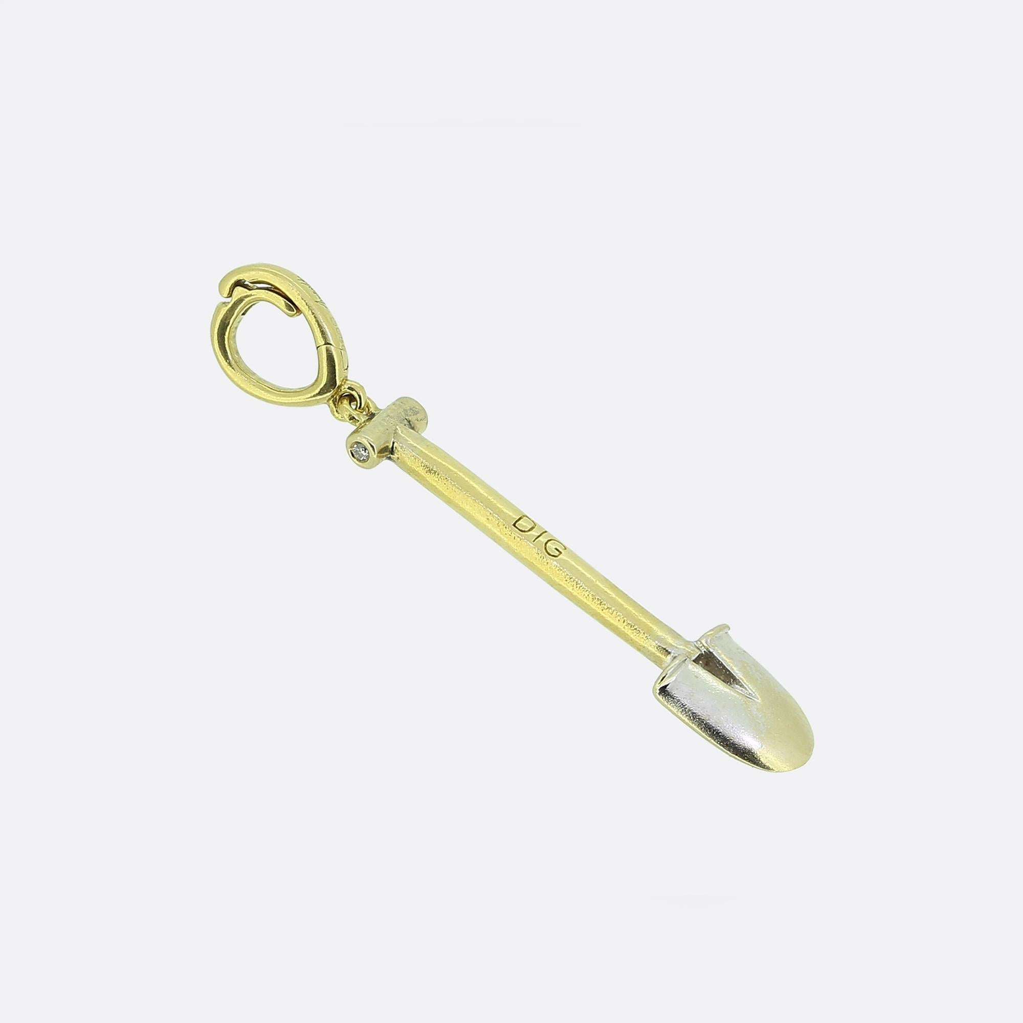 Here we have an 18ct yellow gold charm from one of Britain's most esteemed modern jewellery designers, Annoushka. Meticulously crafted into the shape of a shovel, the charm features a polished finish with a sleek and minimalist form. The smooth