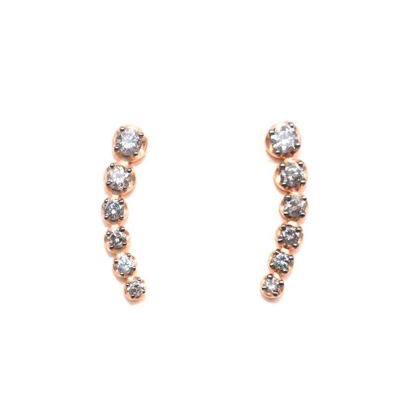 Annoushka Dusty Diamonds 18ct Rose Gold Ear Climbers

Crafted in 18ct rose gold and hand set with 12 dazzling white pave grey diamonds. 
Wear positioned as you like on the ear, style alone or in combination with other pieces. 
Long curved pin