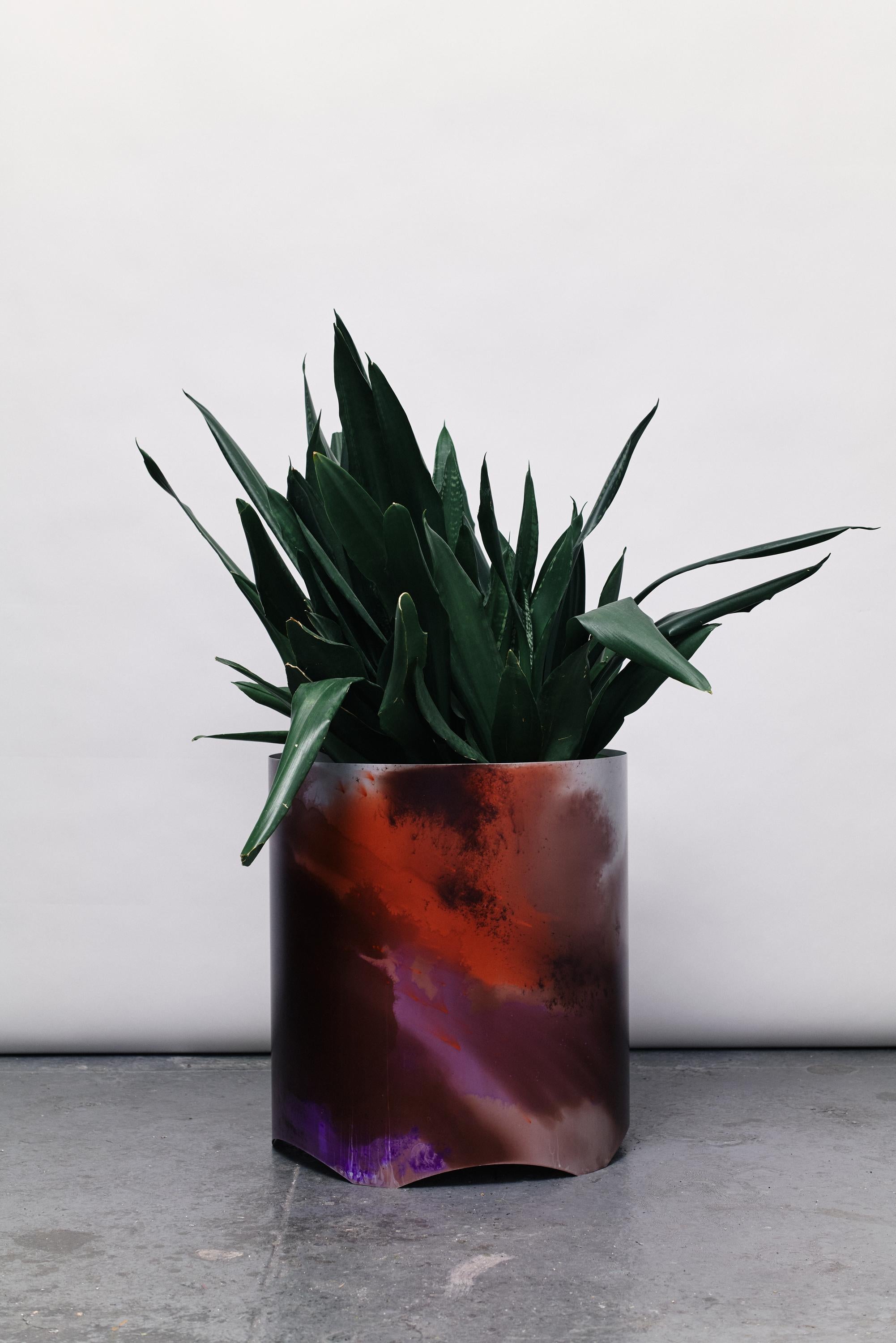 Cosmos extends the exploration into manually anodised aluminium pieces. Building on the success of Grow-UP planters for MCQ in 2021, the collection showcases abstract anodising dye patterns, evoking the beauty of space photography, seamlessly
