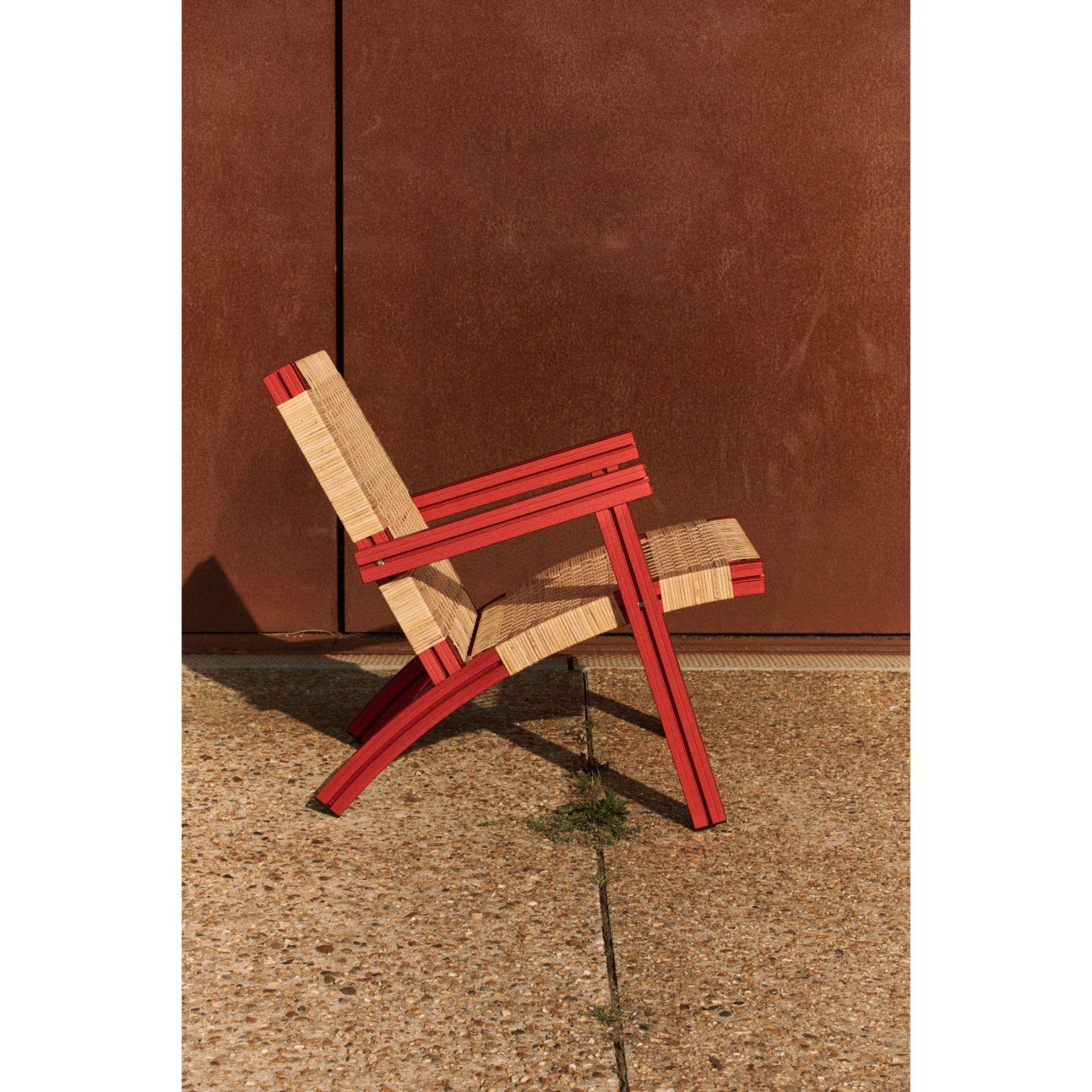 Anodised burgundy and cane wicker armchair by Tino Seubert.
Dimensions: D 73 x W 72 x H 74 cm.
Materials: Color anodized aluminum extrusions, cane weave.

Tino Seubert
When he first made his now signature wicker and aluminium stools and benches